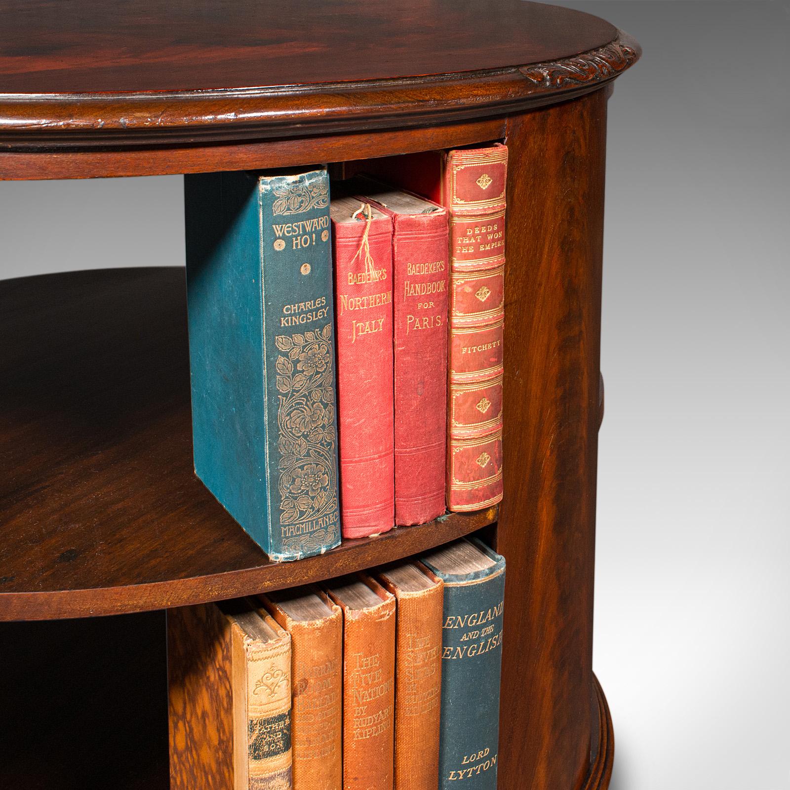 This is a fine antique circular bookcase. An English, mahogany centrepiece library table, dating to the Edwardian period, circa 1910. A superb piece for the discerning reader or a refined lounge setting.

Attractive Edwardian period bookcase, ideal