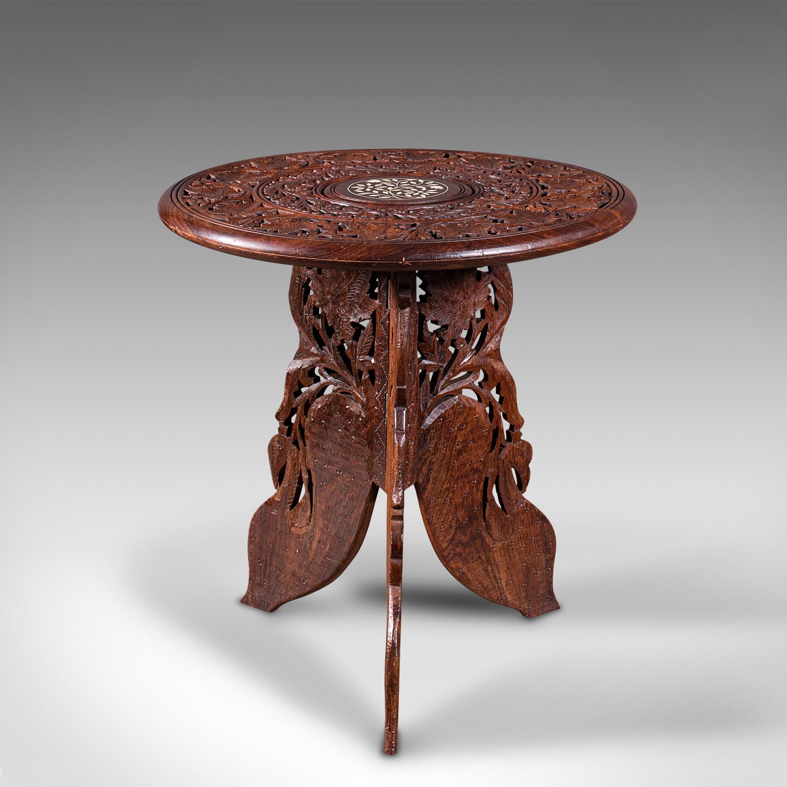 This is an antique circular side table. An Anglo-Indian, Chinese rosewood fold away lamp or wine table with Moorish taste, dating to the early 20th century, circa 1920.

Exotic taste with fascinating detail and finish
Displays a desirable aged