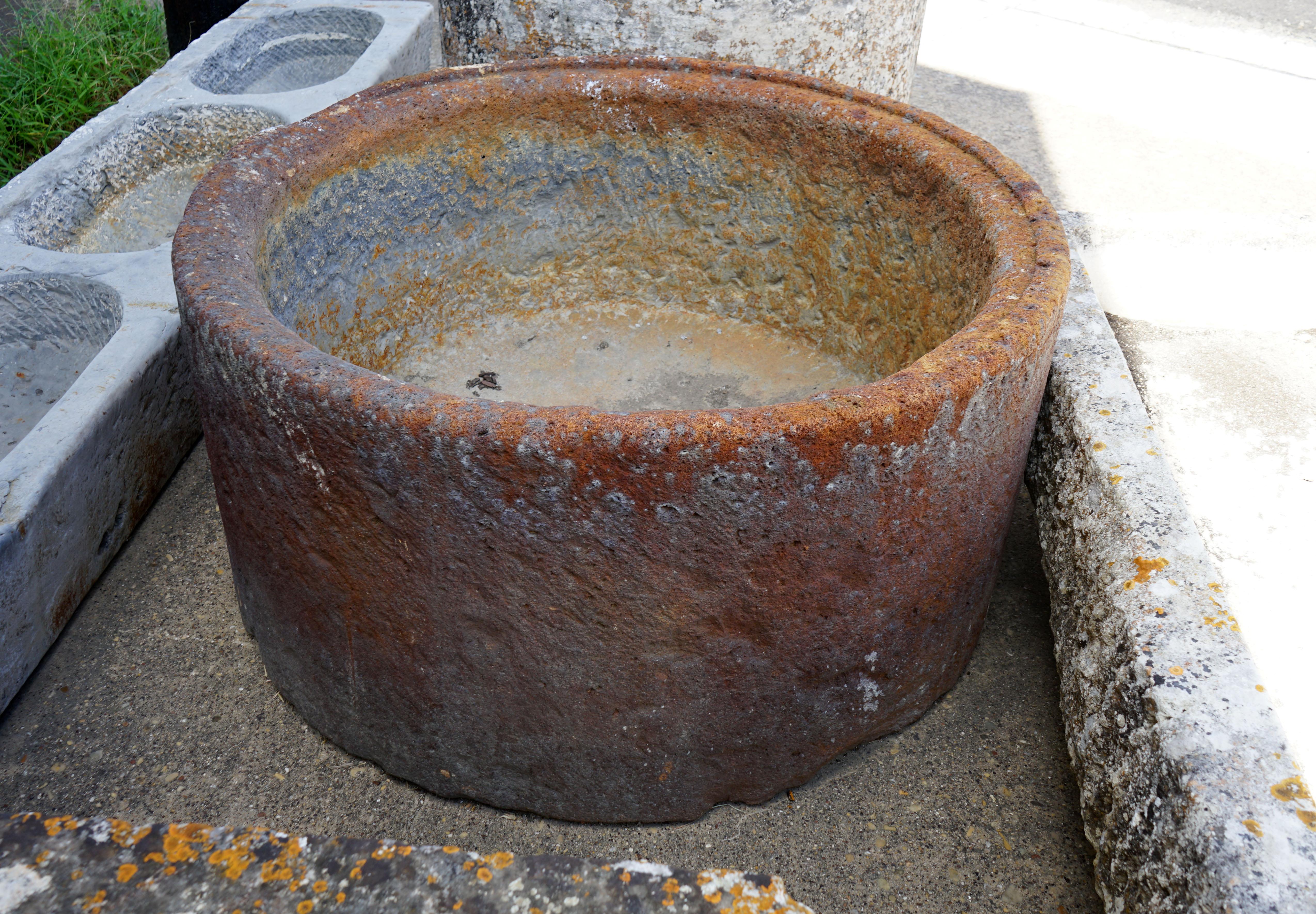 This circular trough could also function as a planter or fire pit.

Measurements: 47'' diameter 23'' high.