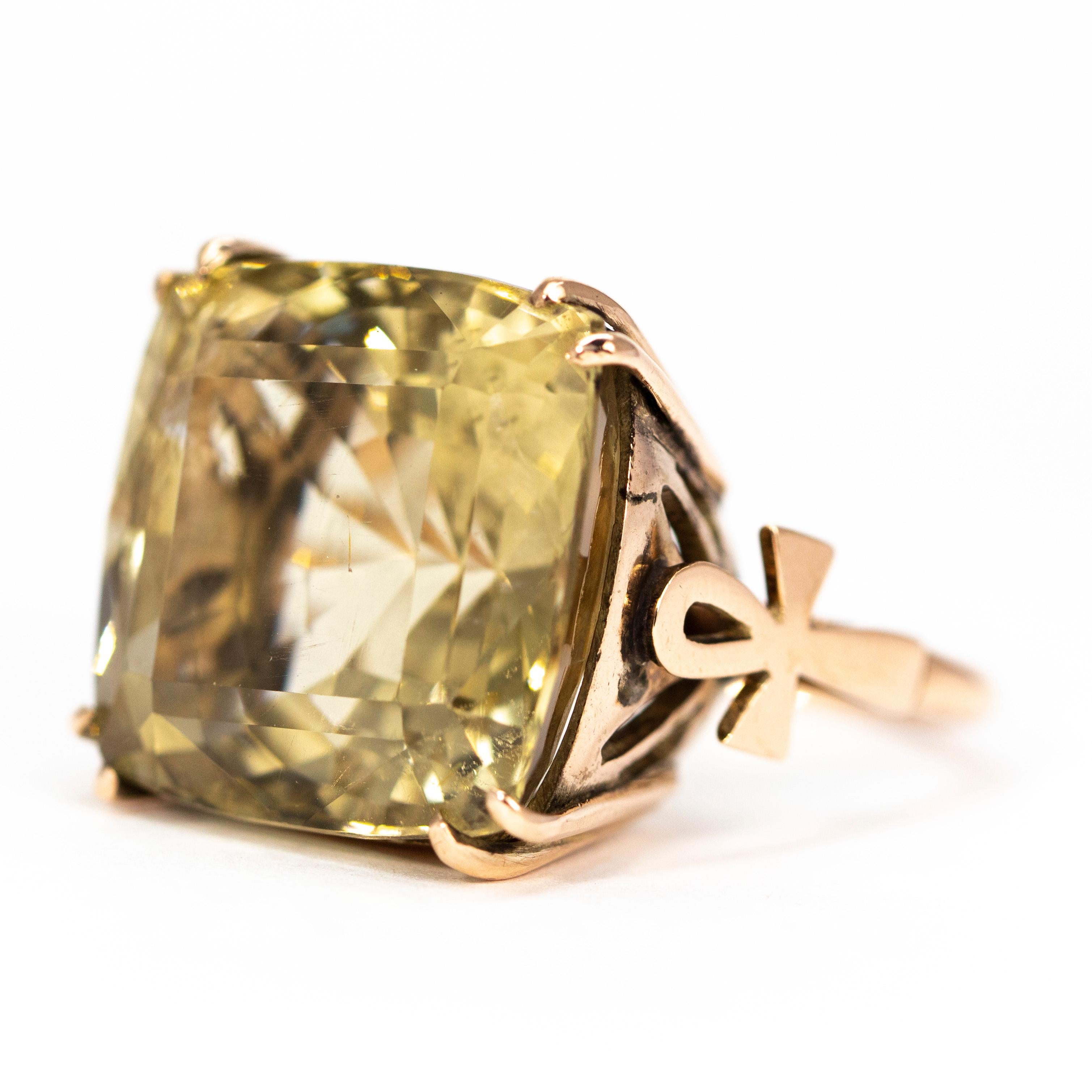 This gorgeous stone is approximately 20carat and set within a 9 carat gold bishops ring with the ankh symbol modelled in the gold on the shoulders. The citrine stone is pale yellow and wonderfully cut which reflects the light beautifully.

Ring