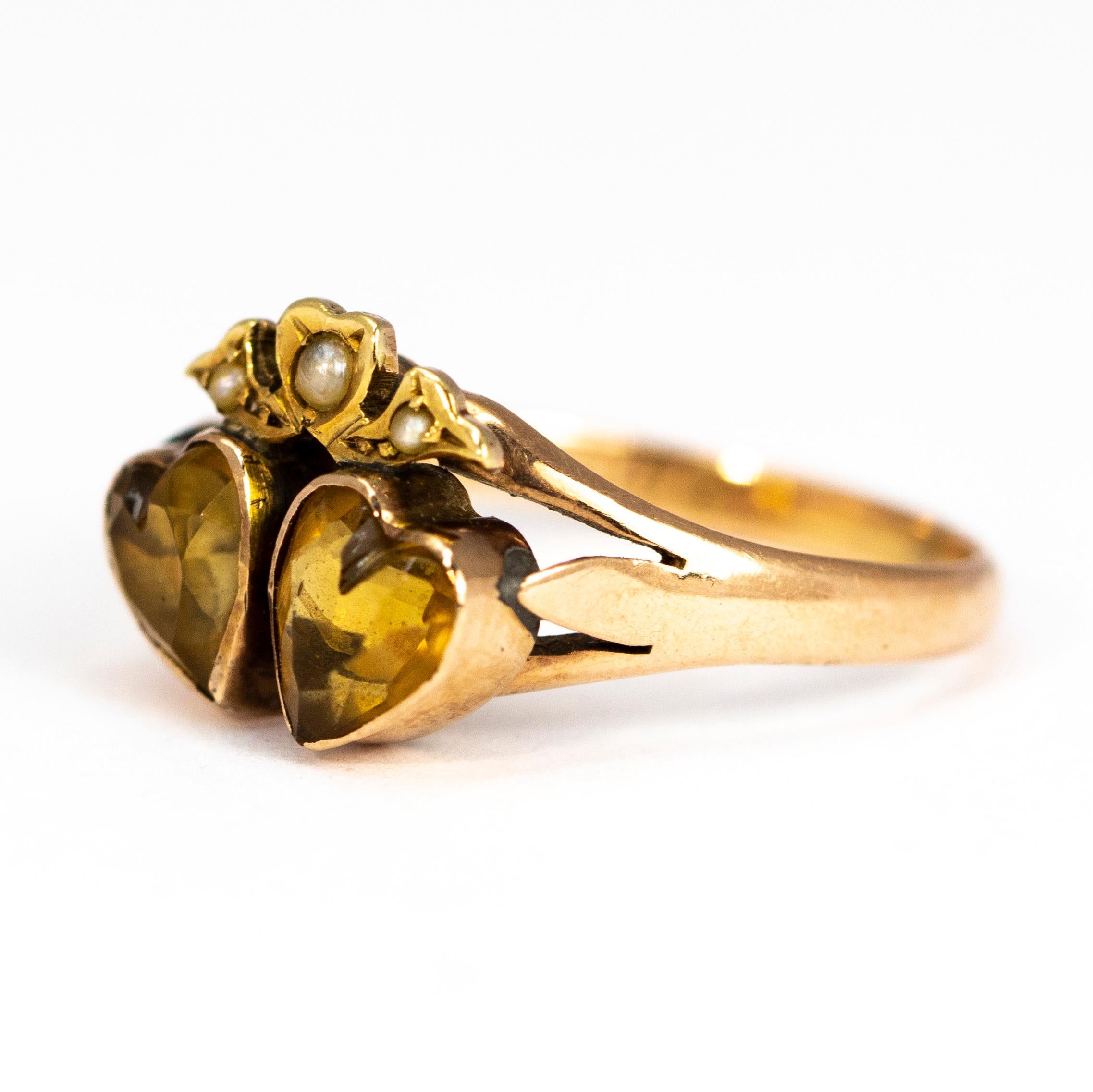 The design of this ring is just lovely with two heart shaped citrine stones set in fine 9ct gold. Above the double hearts is further heart and ribbon detail set with seed pearls. 

Ring Size: M 1/2 or 6 1/2 
Heart Dimensions: 6.5 x 6mm 

Weight: 2.5g