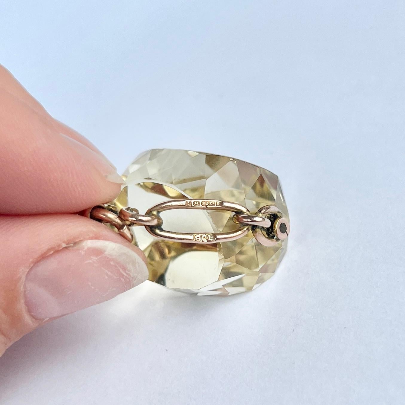 This gorgeous swivel fob holds a yellow citrine stone and the frame and loop is modelled out of 9ct gold. The frame has a chain feel to it and twists and turns. Fully hallmarked Birmingham 1908.

Height including Loop: 34mm
Stone Width: