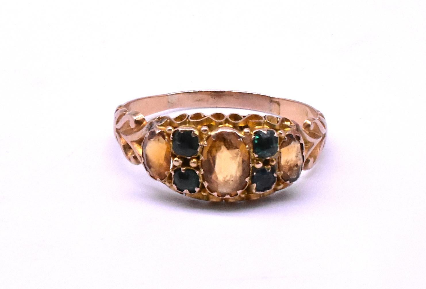 C1860 this lovely  15ct ring in the shape of what we call a classic Victorian five stone ring, has three citrines and four emeralds. The double emeralds flanking the central citrine are an unusual design, and the combination of the yellow and green