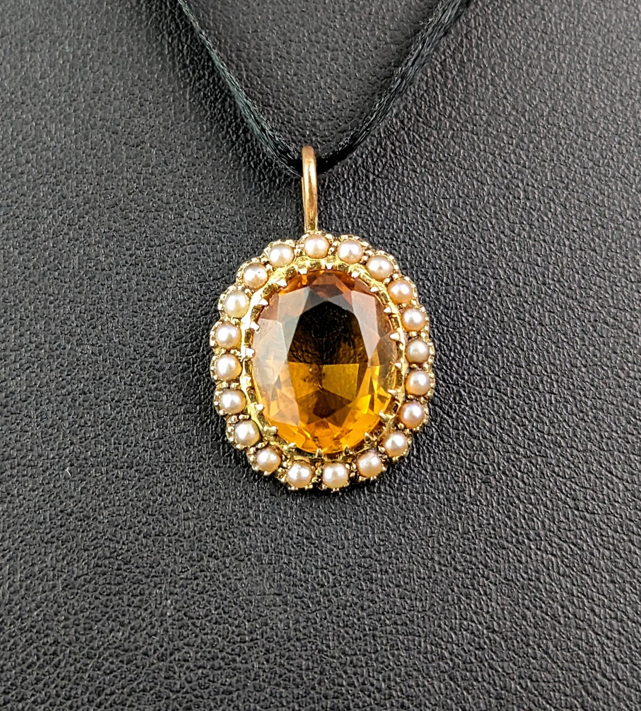 This wonderful little antique citrine and pearl pendant is such a warm and elegant piece.

The rich cognac glow of the antique citrine gives lovely warm vibes and citrine is thought to promote healing and happiness, the lovely faceted oval cut