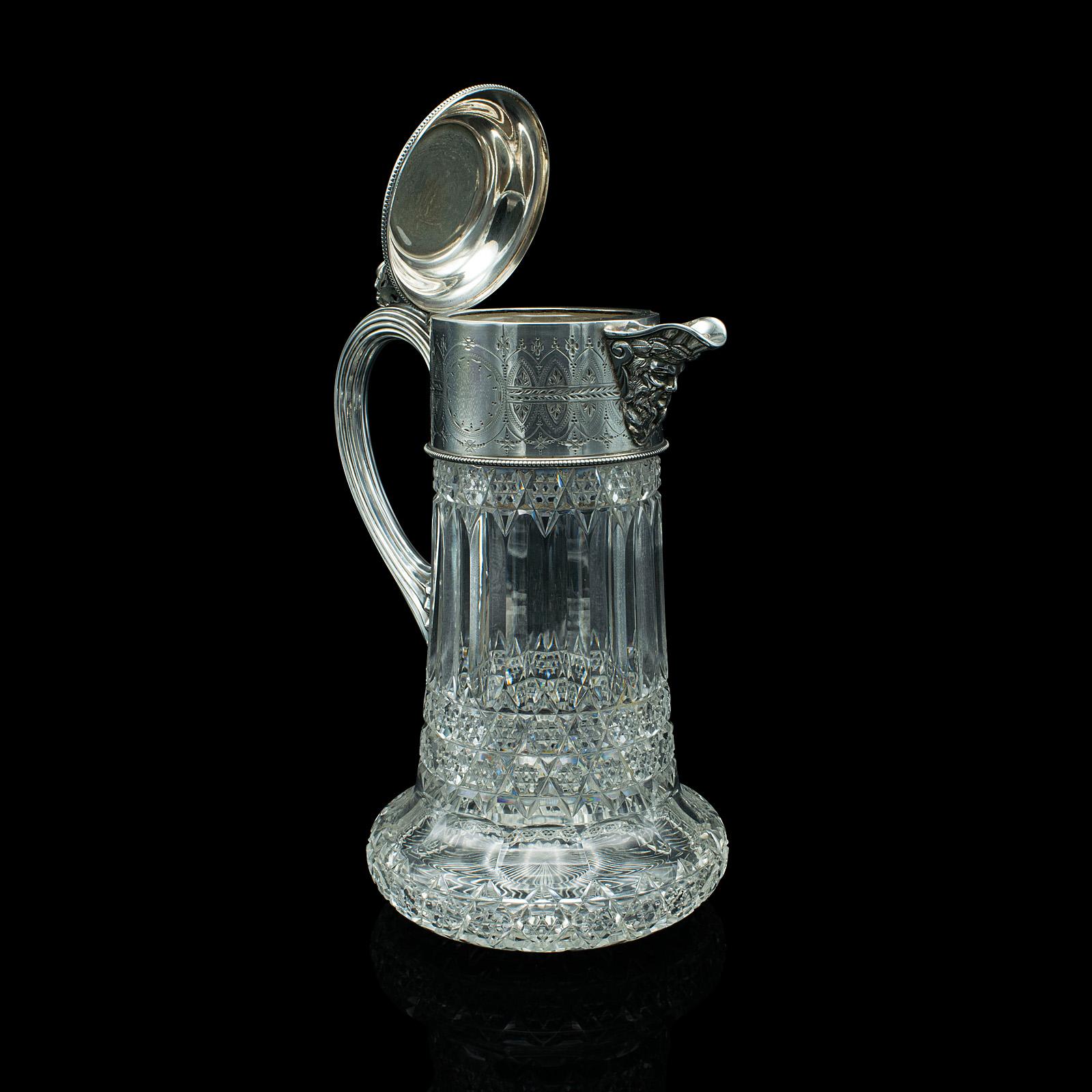 This is an antique claret jug. An English, cut glass and silver plated decanter, dating to the late Victorian period, circa 1900.

Fascinatingly decorative jug with a host of eye-catching finishes
Displays a desirable aged patina and in good