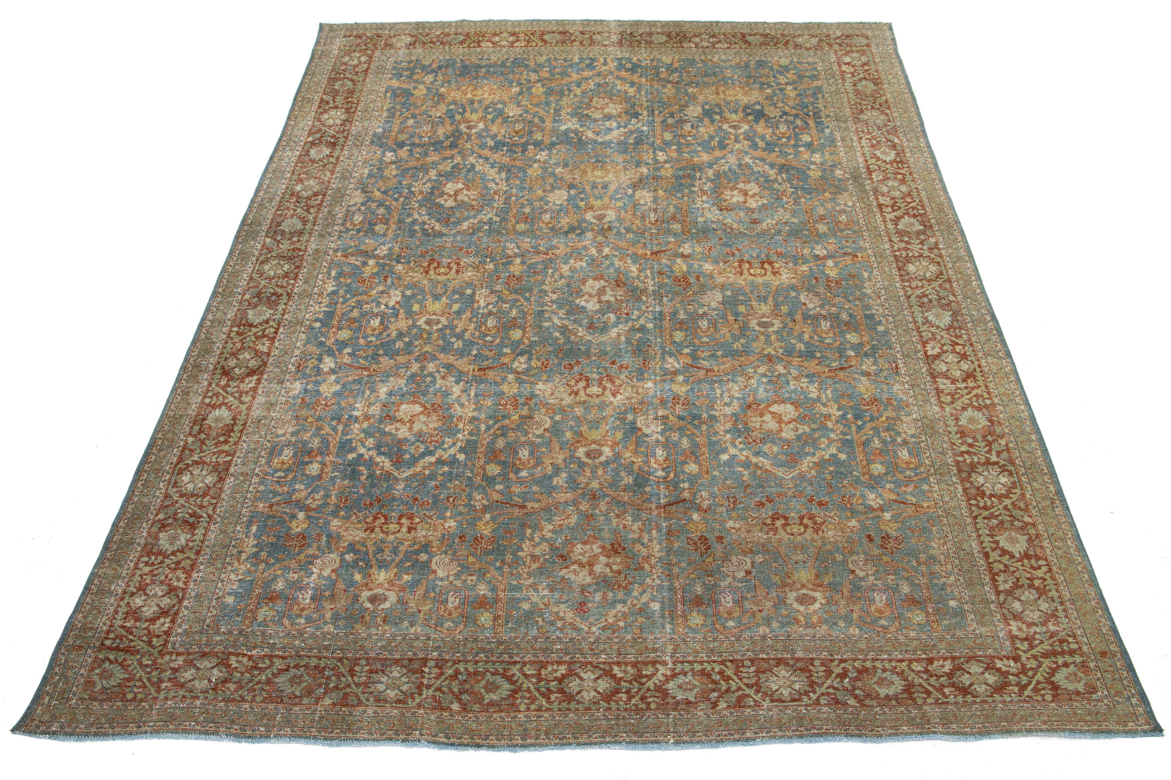 Dieser atemberaubende antike persische Täbriz-Teppich aus den 1910er Jahren zeigt ein leuchtend blaues Feld mit einem komplizierten Blumenmuster, das durch satte Rost- und Beige-Akzente hervorgehoben wird.

Dieser Teppich misst 7' x 10'5