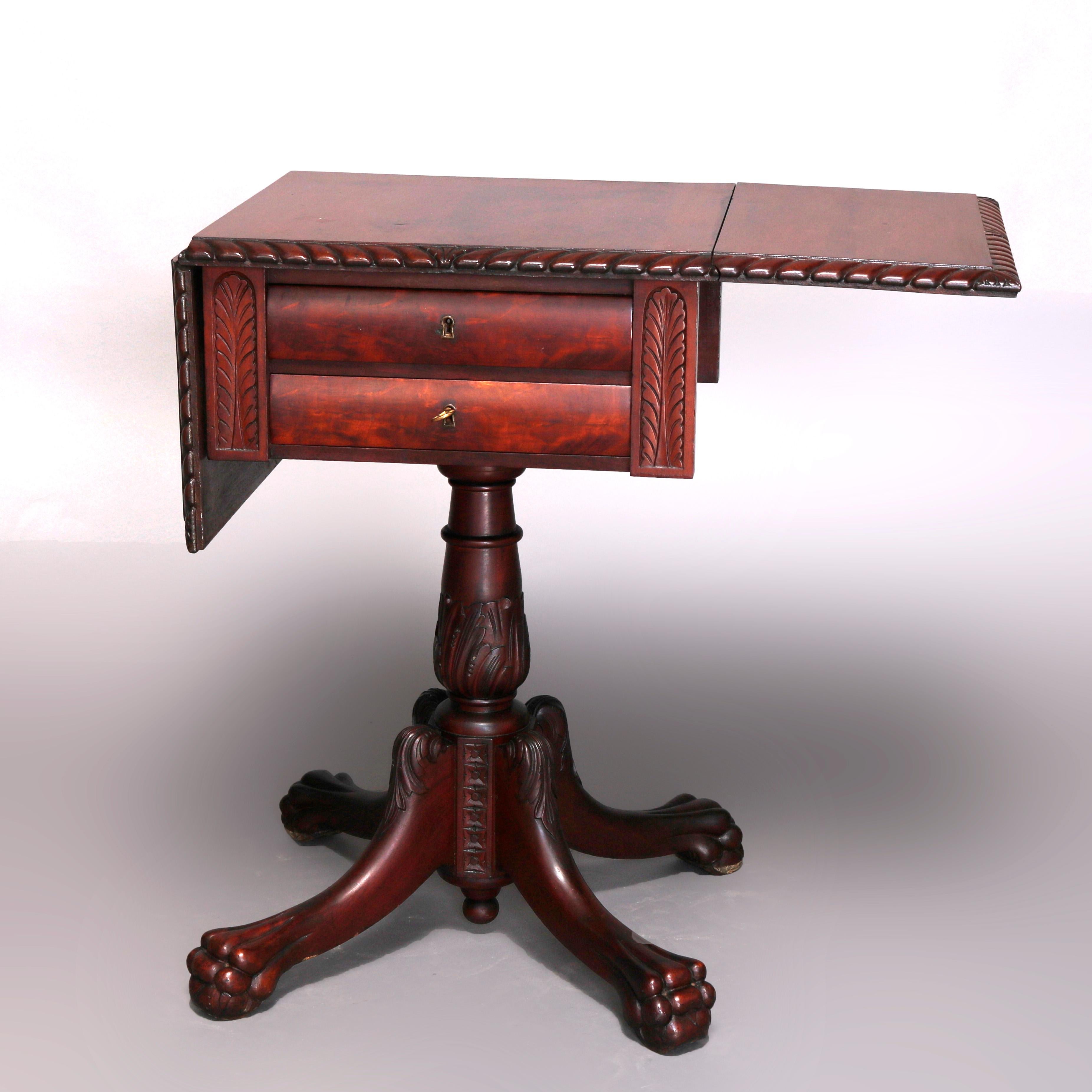 An antique classical American Empire stand offers flame mahogany construction with drop leaf top having carved rope twist bordering over case with two bowed drawers on acanthus carved column raised on cabriole legs terminating in paw feet, 19th