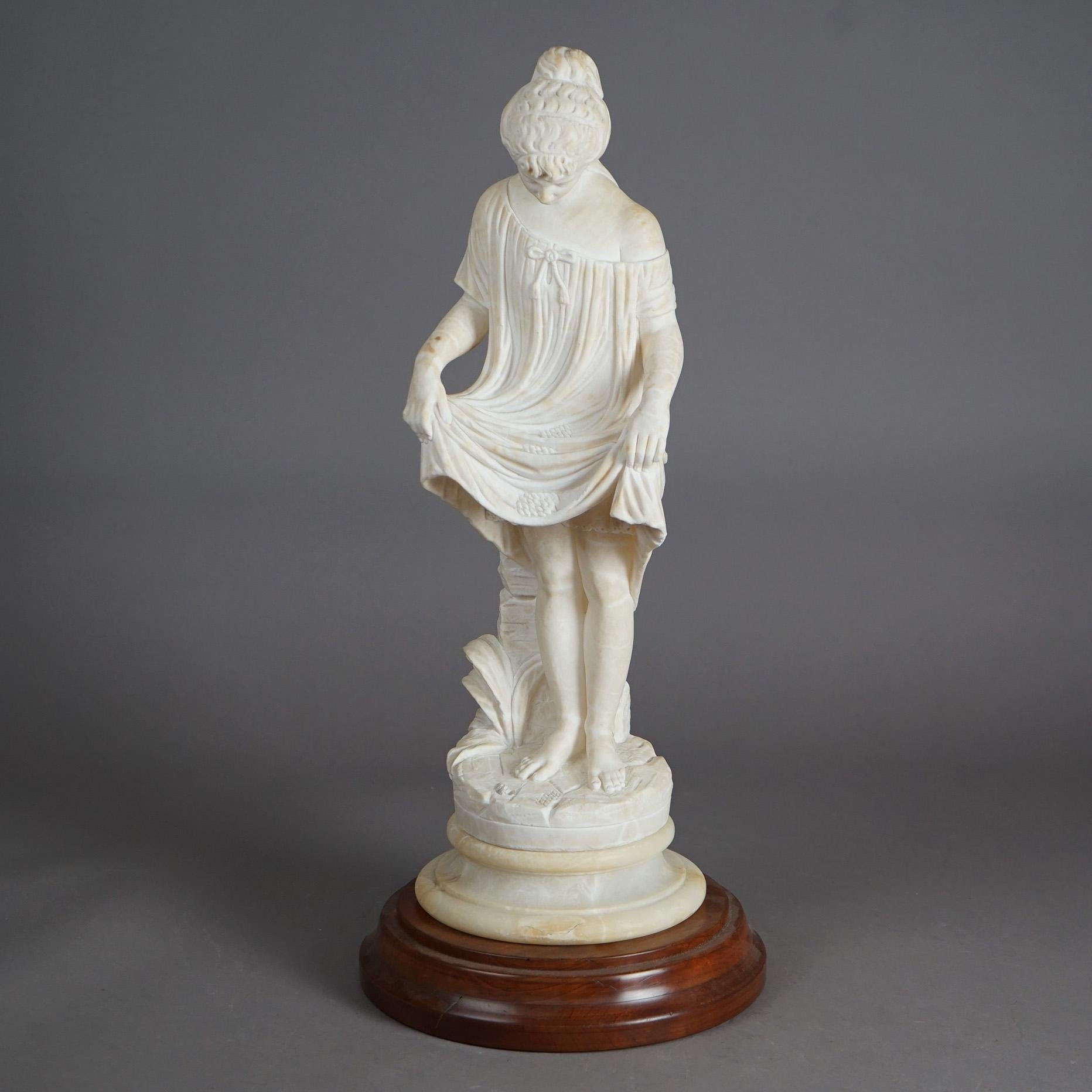 An antique Classical sculpture offers carved alabaster young girl in countryside setting, seated on circular plinth, 19th century

Measures - 24.5