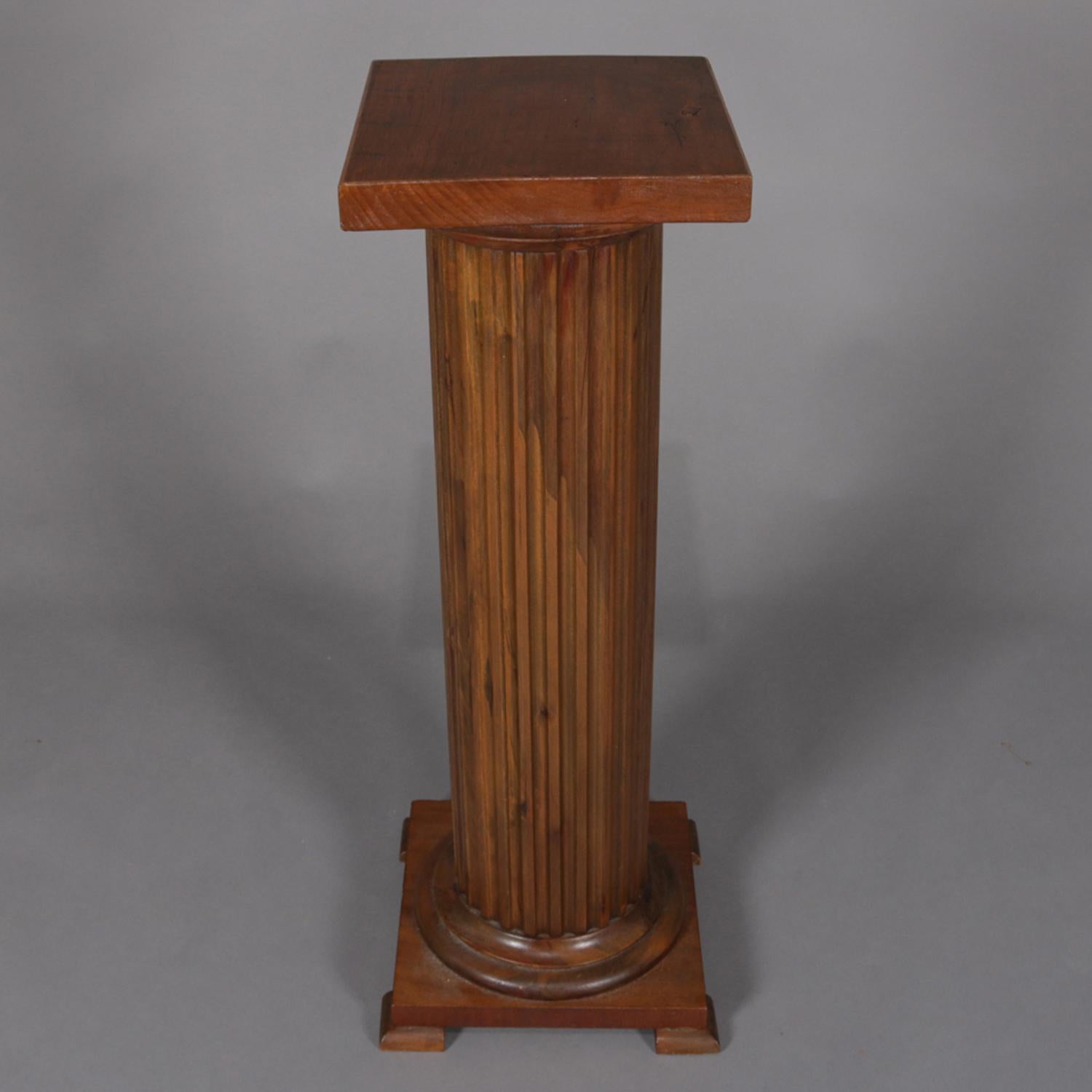 Antique carved oak sculpture display pedestal features Classical Corinthian column-form with reeded shaft having stepped volute and footed base, circa 1900.

Measures: 35.5