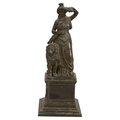 Statue antique en bronze coulé classique d'une femme et d'un lion, vers 1890