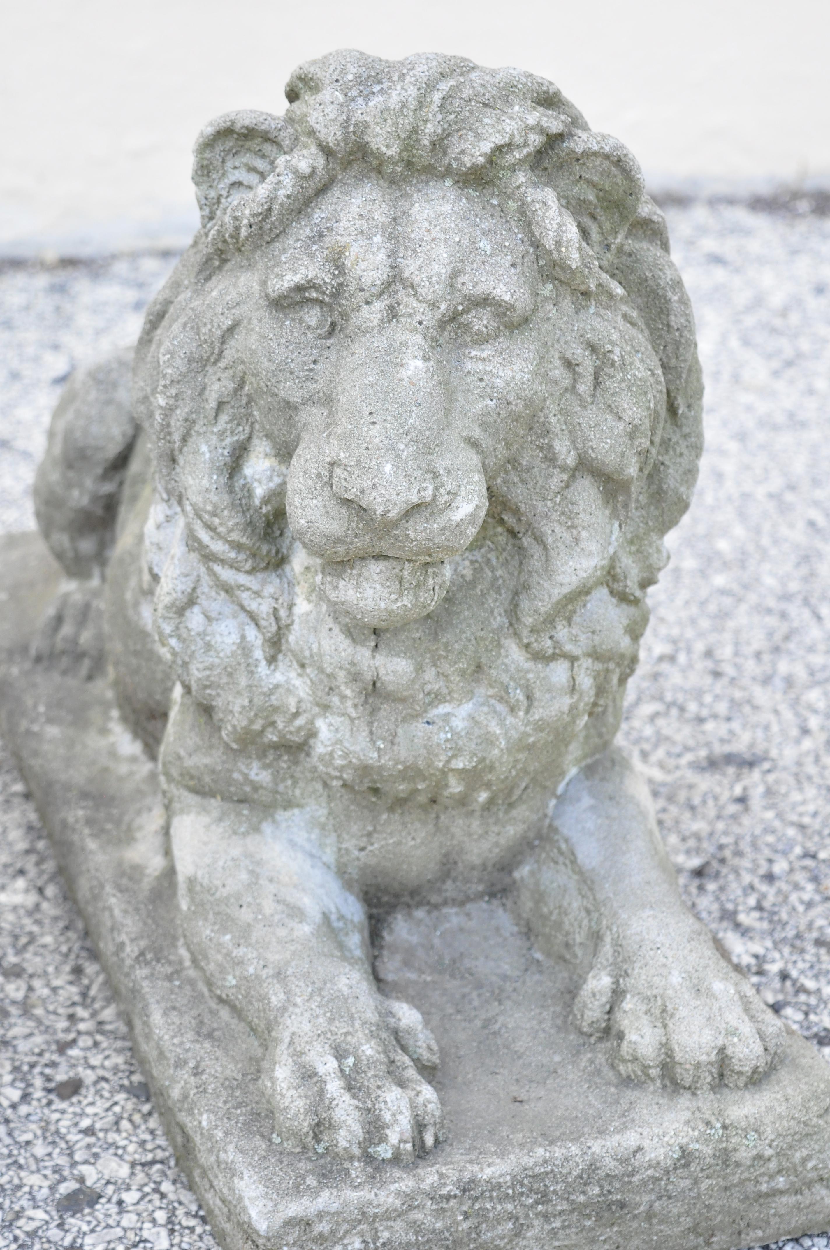 Antique classical concrete reclining resting lion garden statue ornament - a pair. Item features right and left facing, remarkable cast concrete stone details, authentic aged patina, quality craftsmanship. Approx. 120 lbs each. Age: Early 1900s.