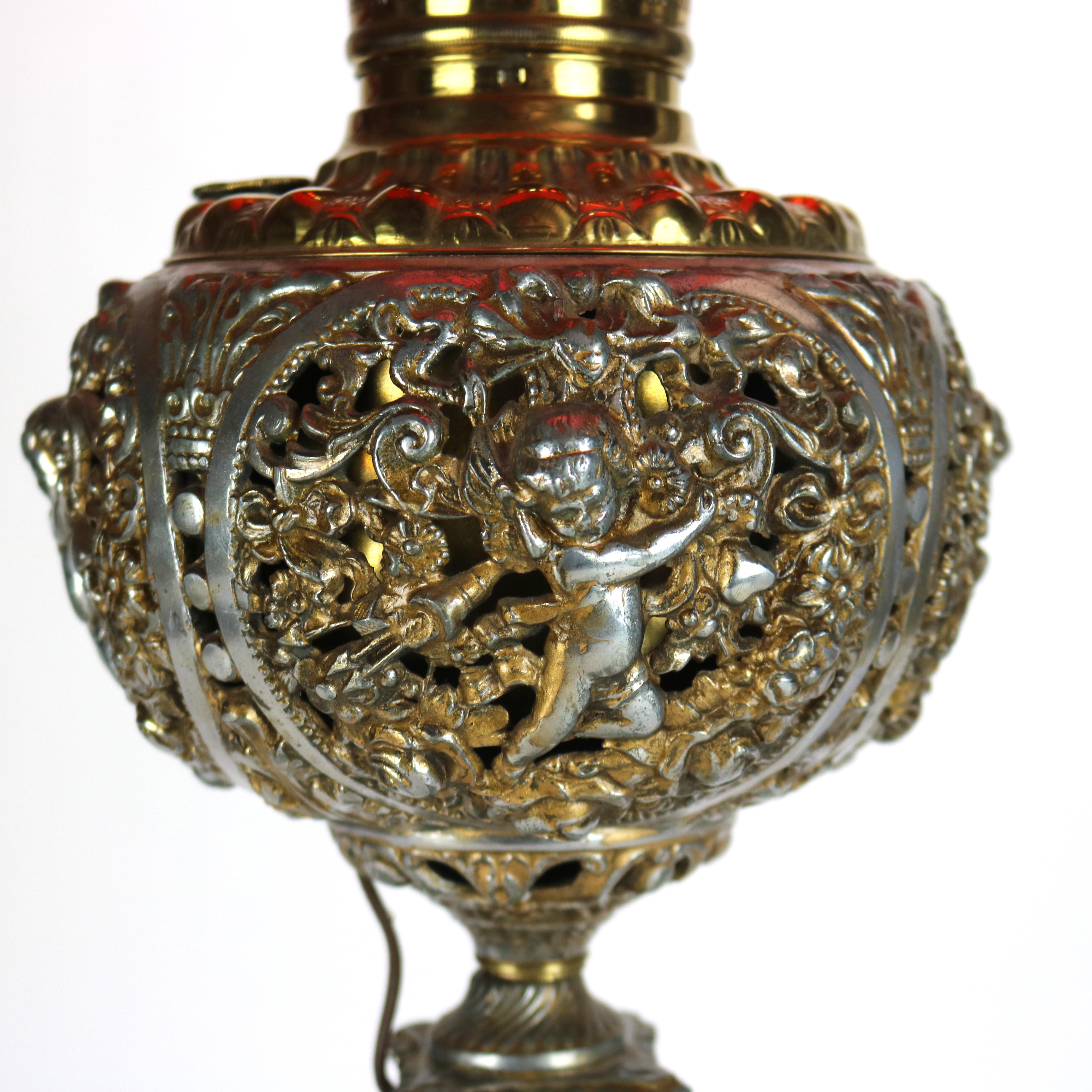 Antique Classical Figural Cherub Onyx Converted To Electric Table Lamp with Red Glass Bullseye Shade C1890

Measures - 30.75