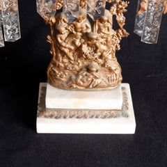 Antico candelabro classico figurato in metallo dorato, 1890 ca.