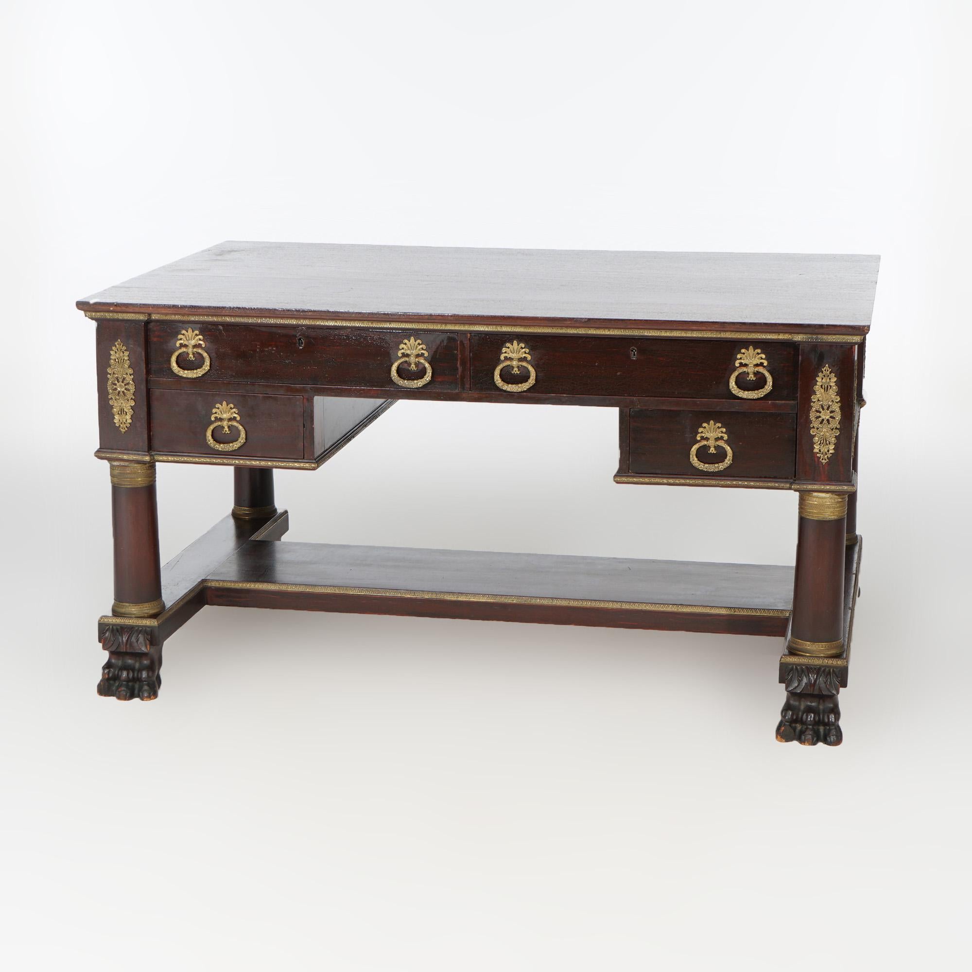 An American Empire Classical Greco partners desk offers flame mahogany construction with double sided full case having drawers and flanking full column supports, raised on carved paw feet, cast ormolu mounts throughout, c1880

Measures - 28.5