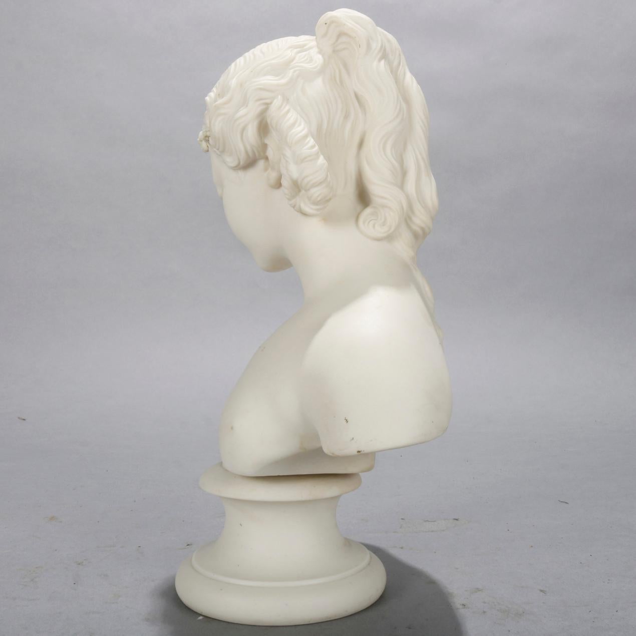 An antique classical Greek parian sculpture bust by Copeland depicts portrait of young woman on plinth, en verso stamped as photographed, circa 1890

Measures: 10.5