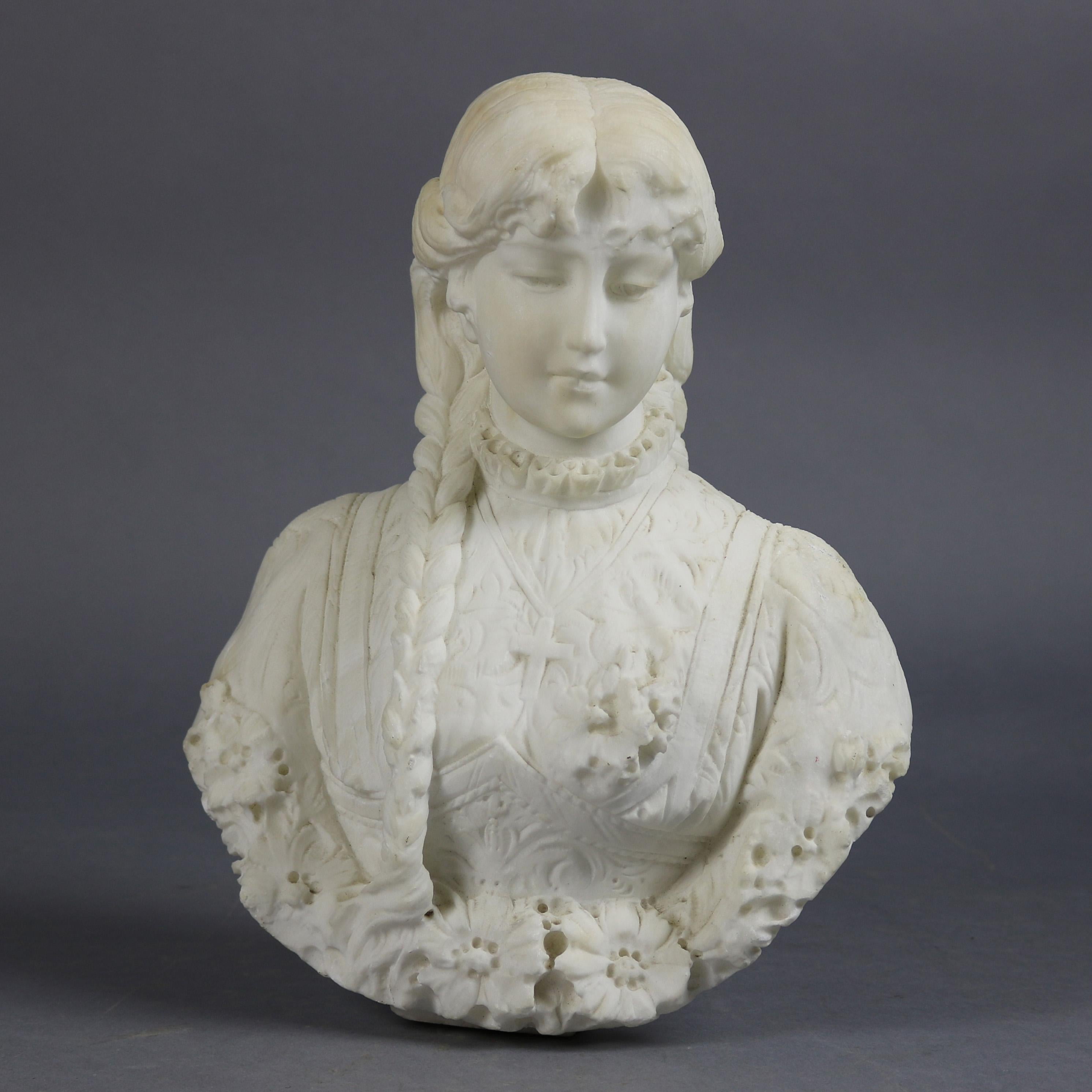 An Italian Classical portrait sculpture features highly detailed carved alabaster bust of a young woman with long braids and a crucifix bordered in floral accents, circa 1890

Measures - 12.5