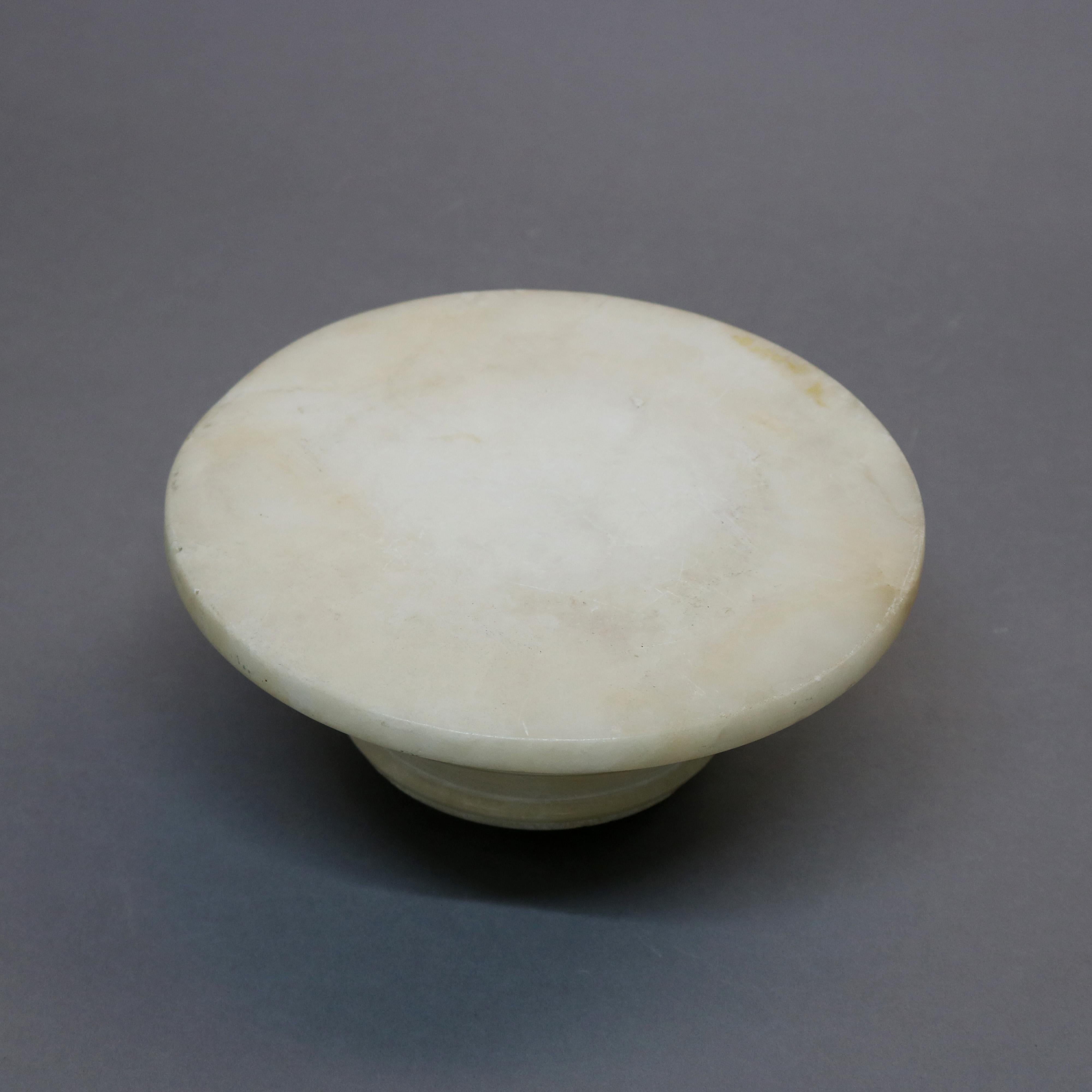 An antique Classical sculpture pedestal offers marble construction in reeded Doric form with round display, raised on octagonal and stepped base, circa 1900. 

Measures: 42.5