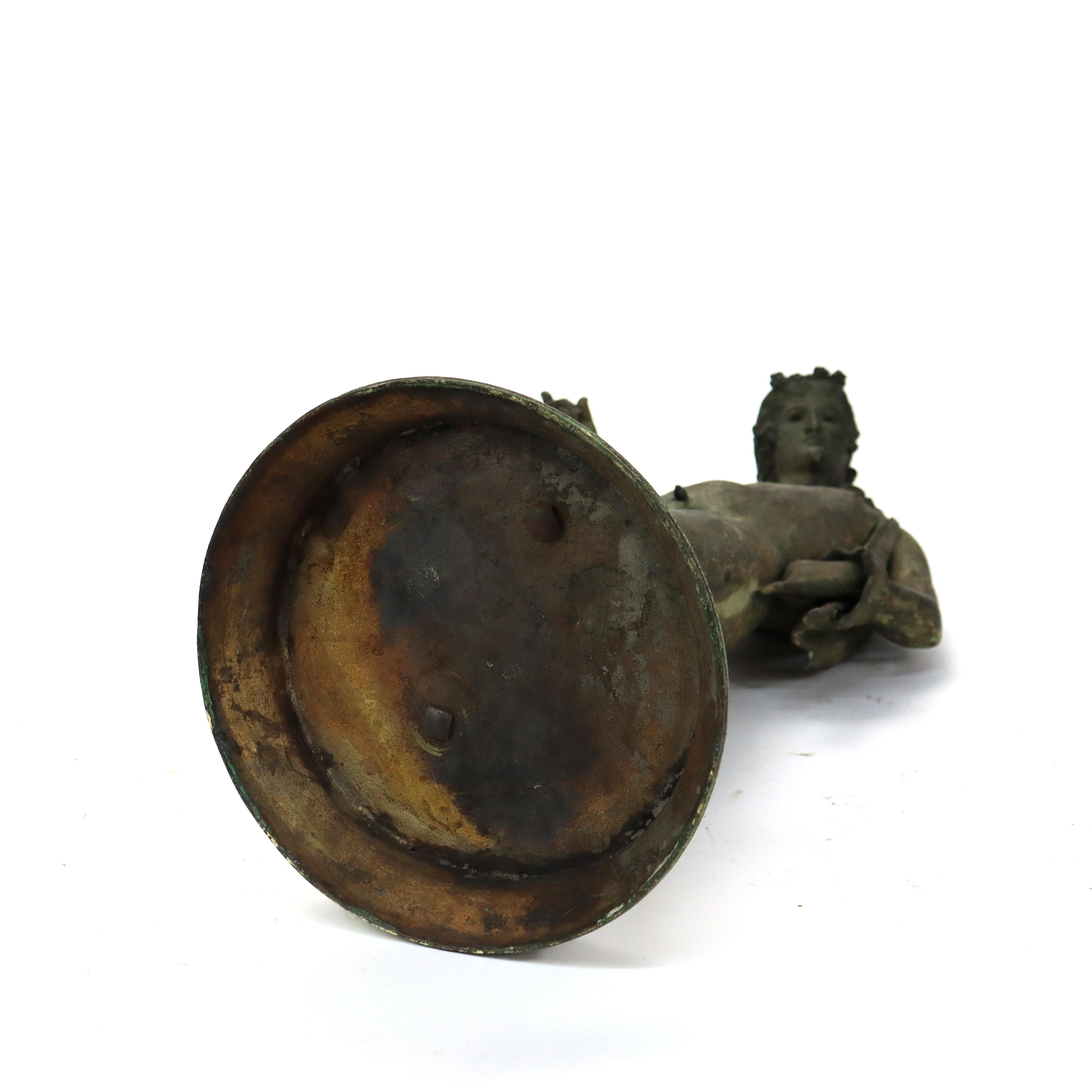 Antique Classical Verdigris Bronze Cherub Fountain Figure 19thC
(19 3/4 h x 10 3/4w x 10 1/4 d).     
A 19th-century Verdigris bronze fountain figure depicting a cherub. This classical piece showcases intricate detailing, capturing the playful and