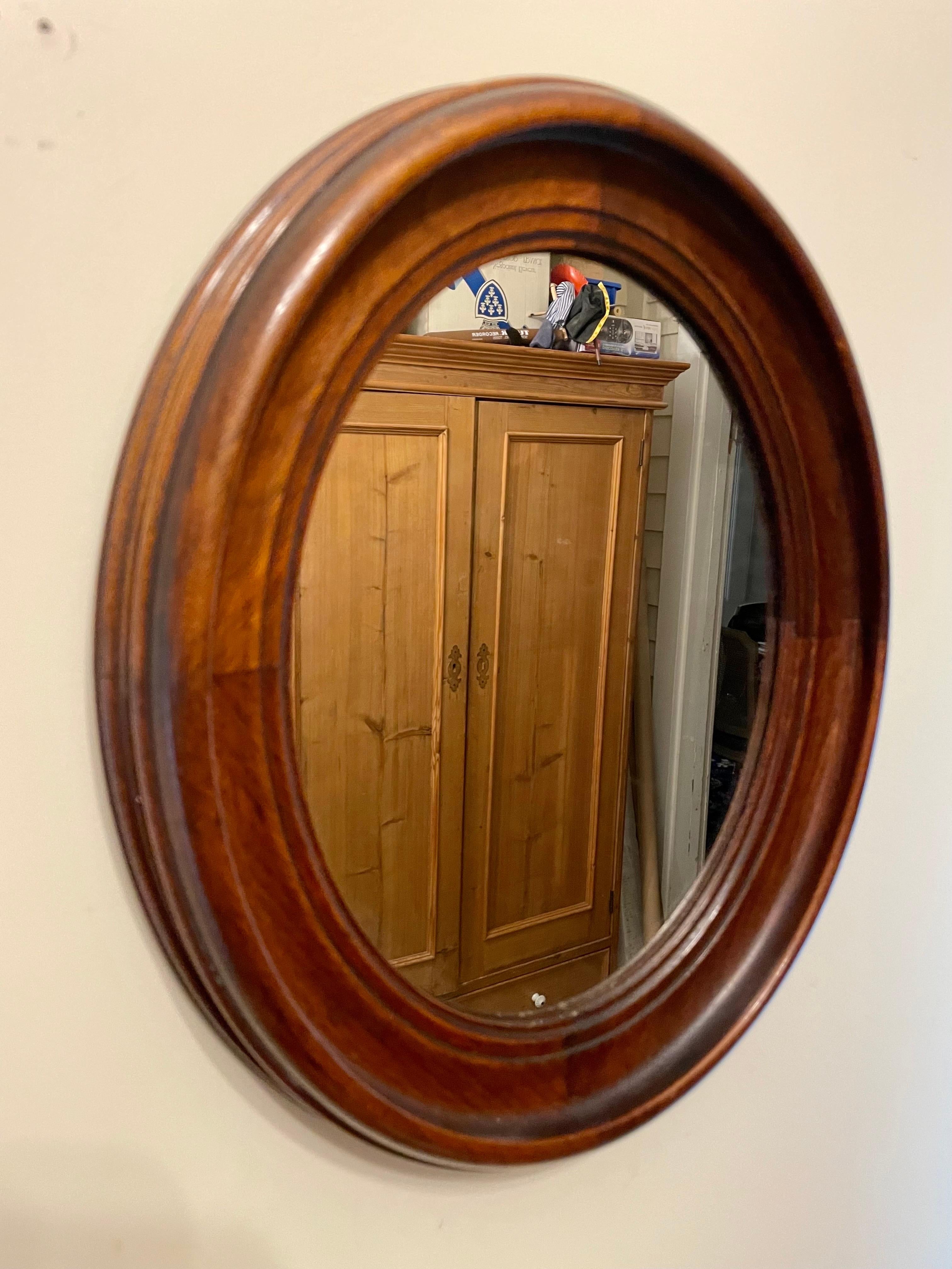 Nice Antique Oval Solid Walnut Classical Deep Frame Mirror, a stunning piece that combines timeless elegance with rich craftsmanship. This mirror features a deep frame crafted from high-quality walnut wood, adding warmth and sophistication to any