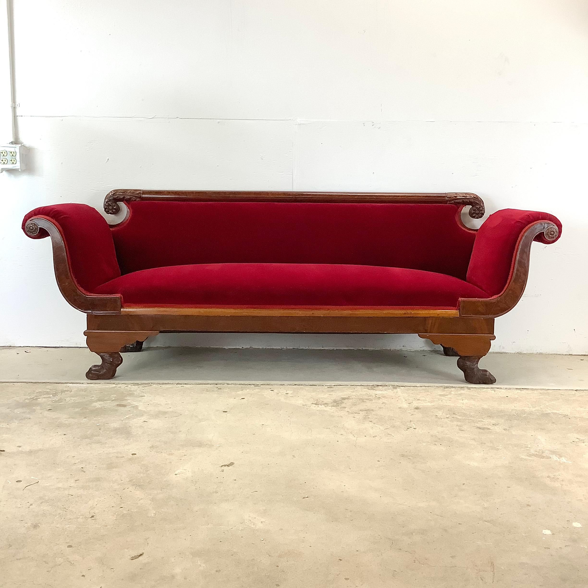Discover the timeless elegance of traditional American 19th century seating with this stunning Duncan Phyfe style Empire sofa, a perfect blend of style, comfort, and history. Crafted from carved rich mahogany, this antique sofa features exquisite