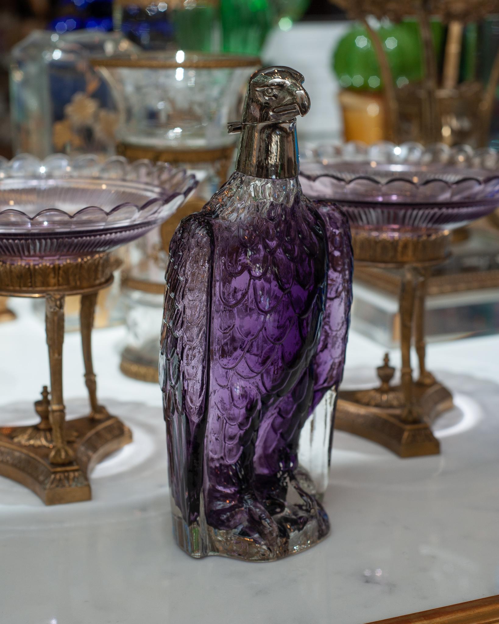 Start the night by pouring a glass of wine from this unusual silver clear to purple eagle decanter. Silver head is hinged at the neck to pour and fill. This conversation piece will enhance any evening with friends.