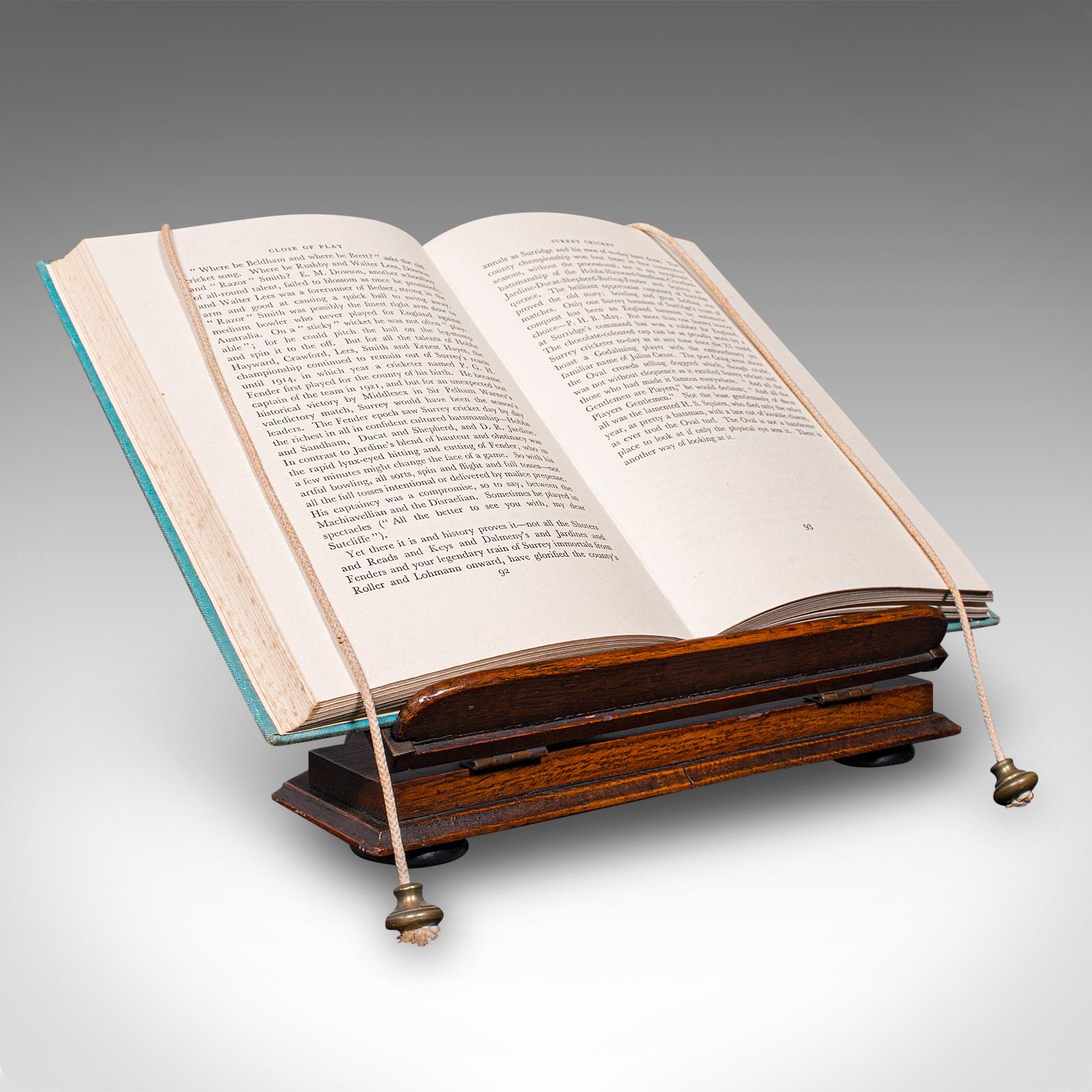 This is an appealing antique cleric’s book stand. A Middle Eastern, folding lectern in rosewood with brass page weights, dating to the Victorian period, circa 1880. Rich in ecclesiastical charm and crafted with fine detail, this versatile stand is