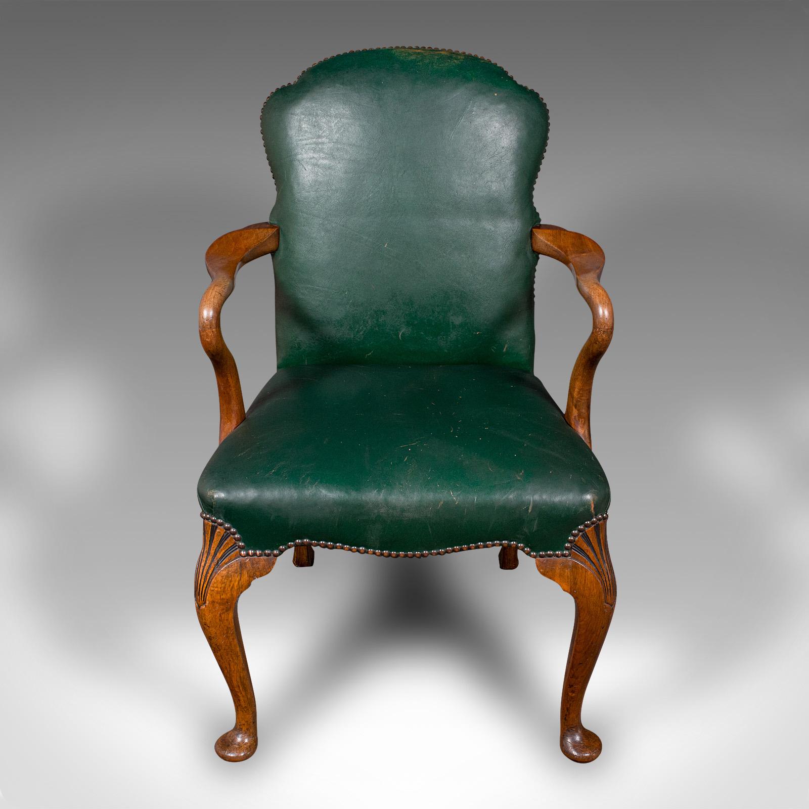 This is an antique clerk's desk chair. An English, beech and leather elbow seat, dating to the early 20th century, circa 1920.

Appealing example, with a tasteful office aesthetic and great colour
Displays a desirable aged patina and in good