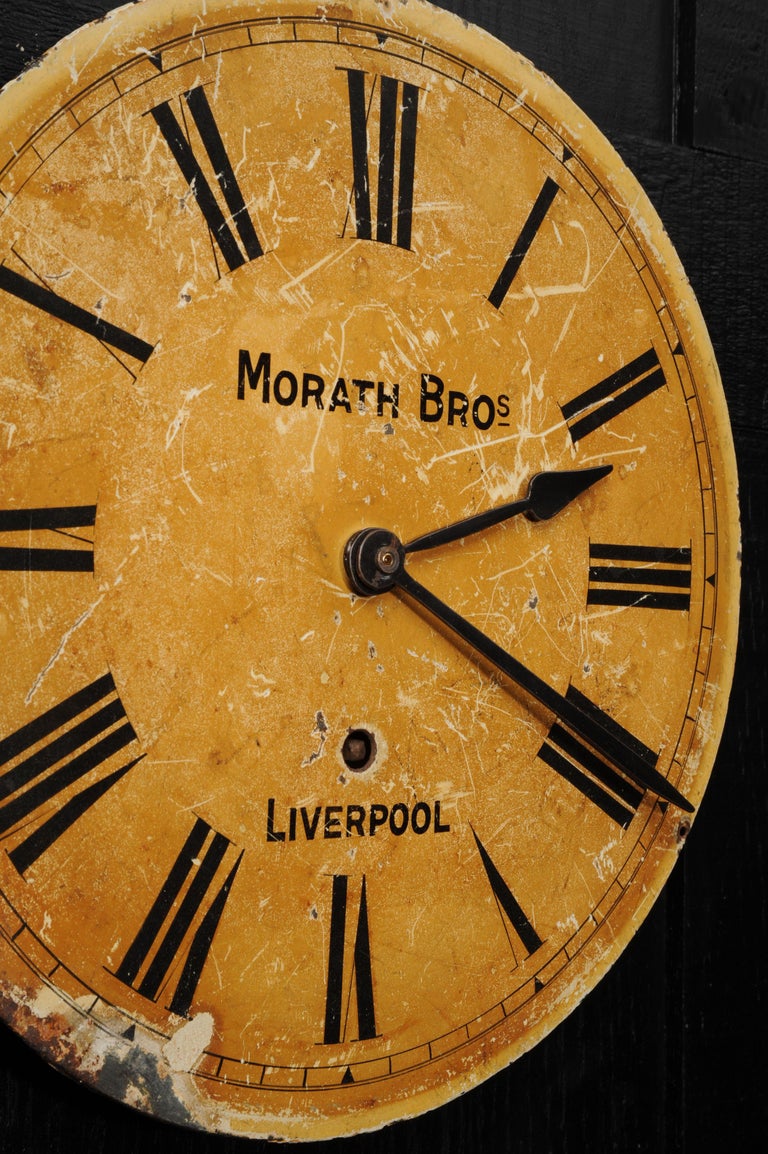 A lovely painted metal clock dial signed Morath Brothers, Liverpool. Found in an industrial building, it bares the scars of a hard life. Originally a mechanical movement by the famed maker Morath Brothers, this was mostly missing, our clockmaker has