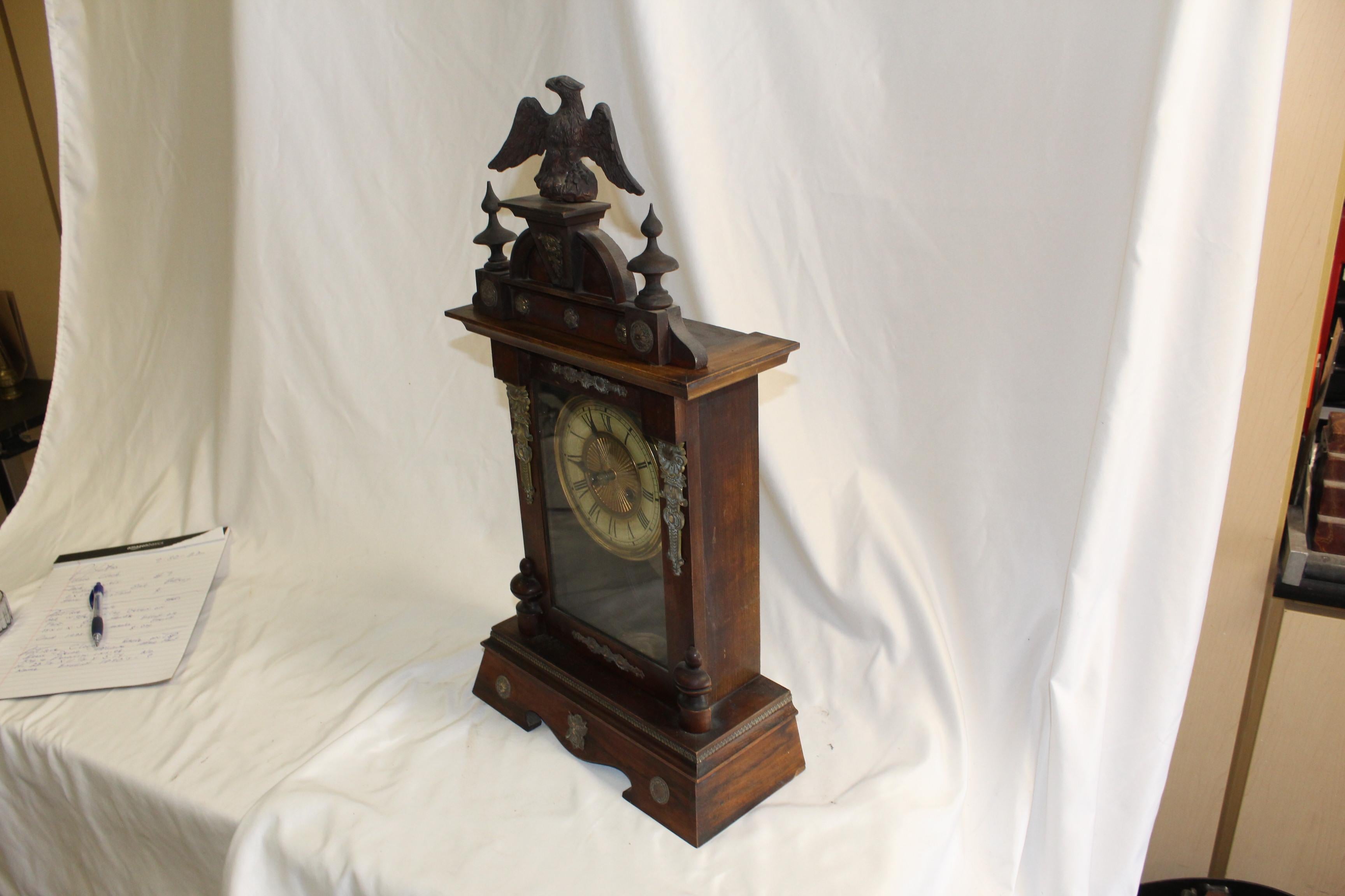 Walnut Antique Clock / Eagle top with brass appliques around  For Sale