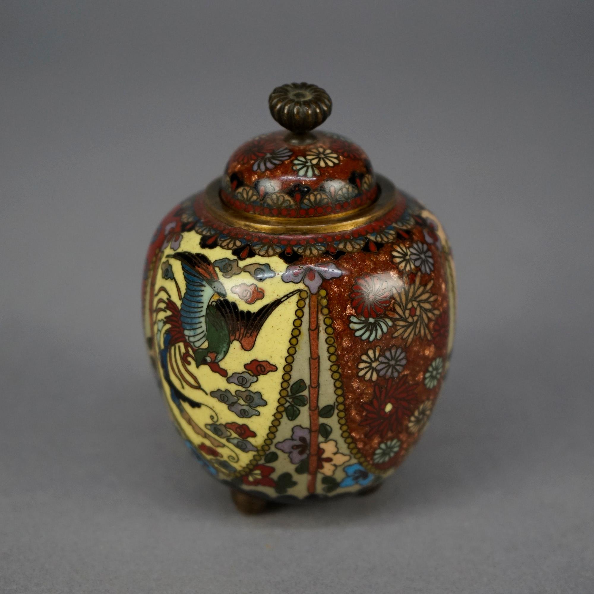 An antique Cloisonne scent jar offers enameled metalwork construction with reserves having birds, butterflies and foliate elements, lidded and footed, c1930

Measures- 4''H x 2.75''W x 2.75''D

Catalogue Note: Ask about DISCOUNTED DELIVERY RATES
