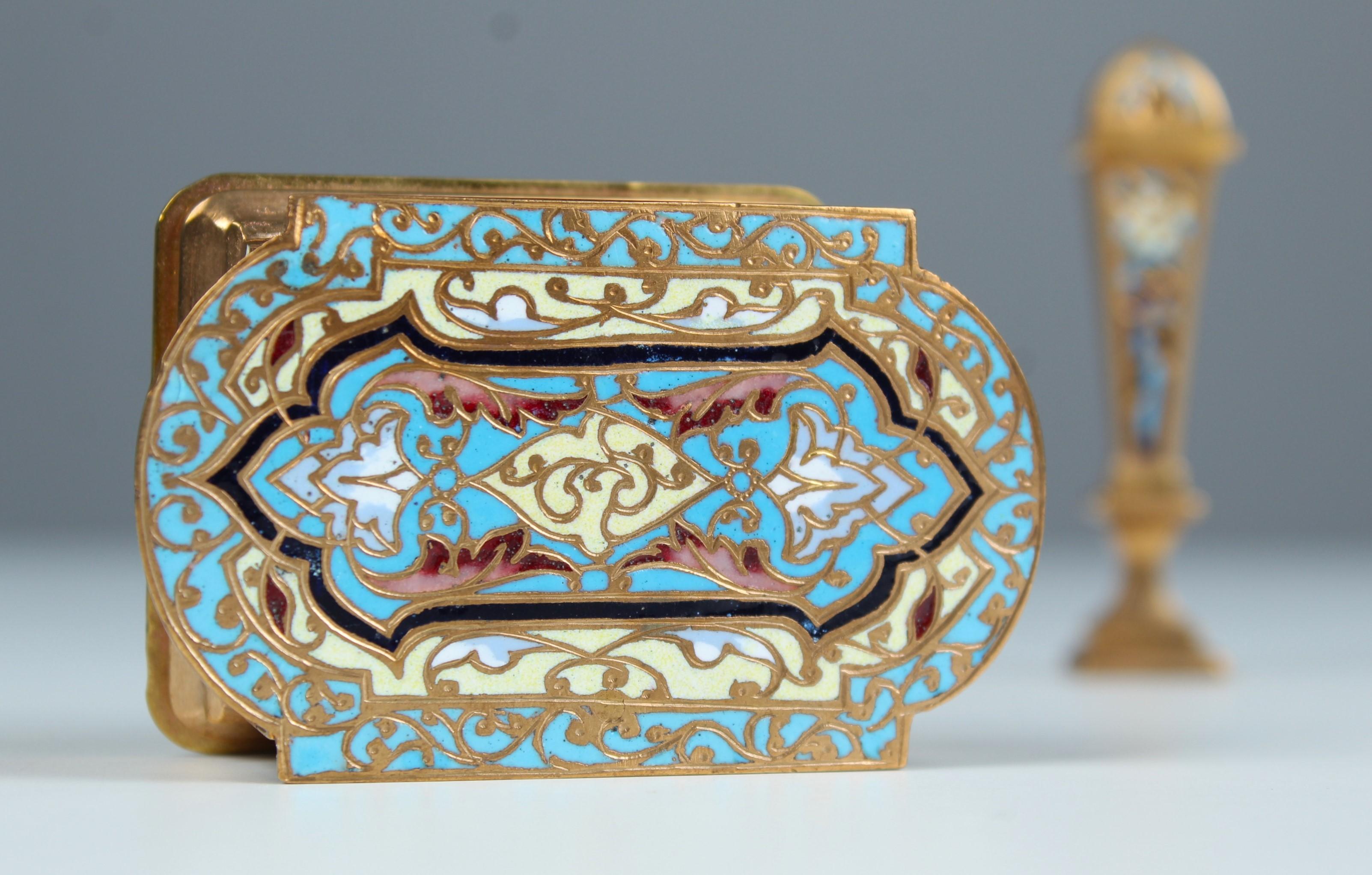 Exceptional Enameled Desk Set of a box and a seal stamp, France circa 1880.
Beautiful Cloisonné- enamel work in bold blue, turquoise, red and beige colours.

Measures:
Stamp- or matches-box: 6 x 5 x 4 cm 
Seal Stamp: 8 x 2 cm






