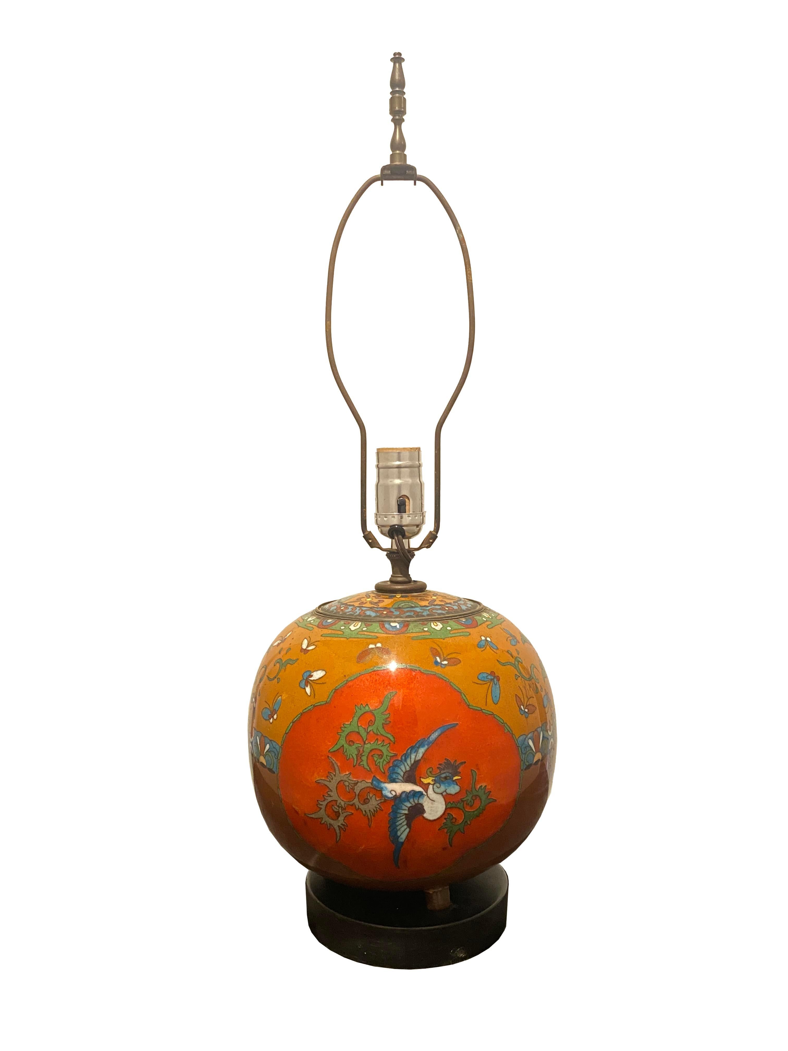 Illuminate your space with this exceptional antique cloisonné enamel footed ginger jar table lamp, a true testament to timeless craftsmanship and artistic flair. Cloisonné, an ancient technique involving intricate wirework to separate and adorn