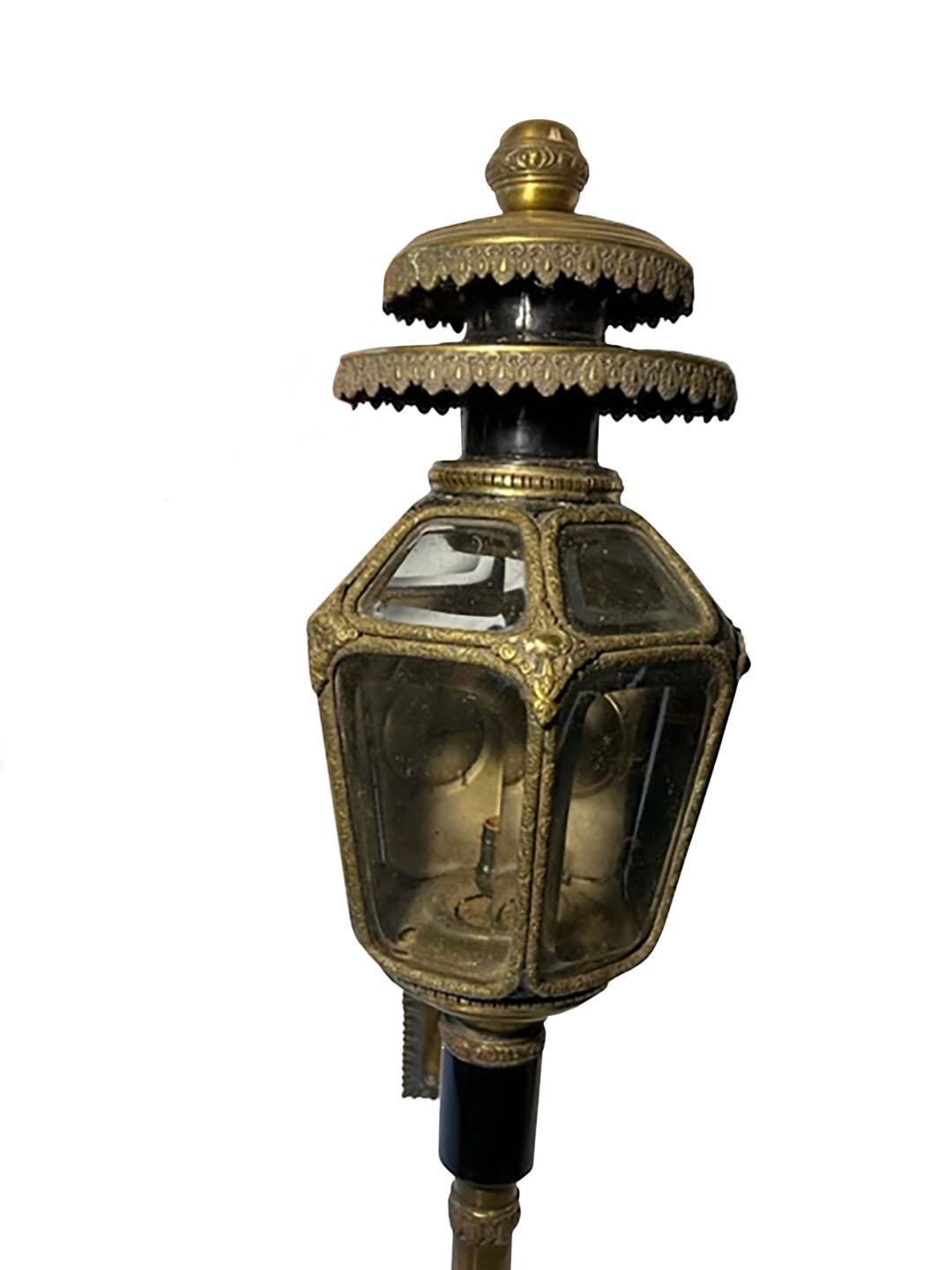 A pair of antique brass coach lamps with original beveled glass, circa 1870, France. The coach lamps are hardwired but needs to be checked by electrician appears to be okay. No guarantees for electrical. Excellent condition no cracks or chips.