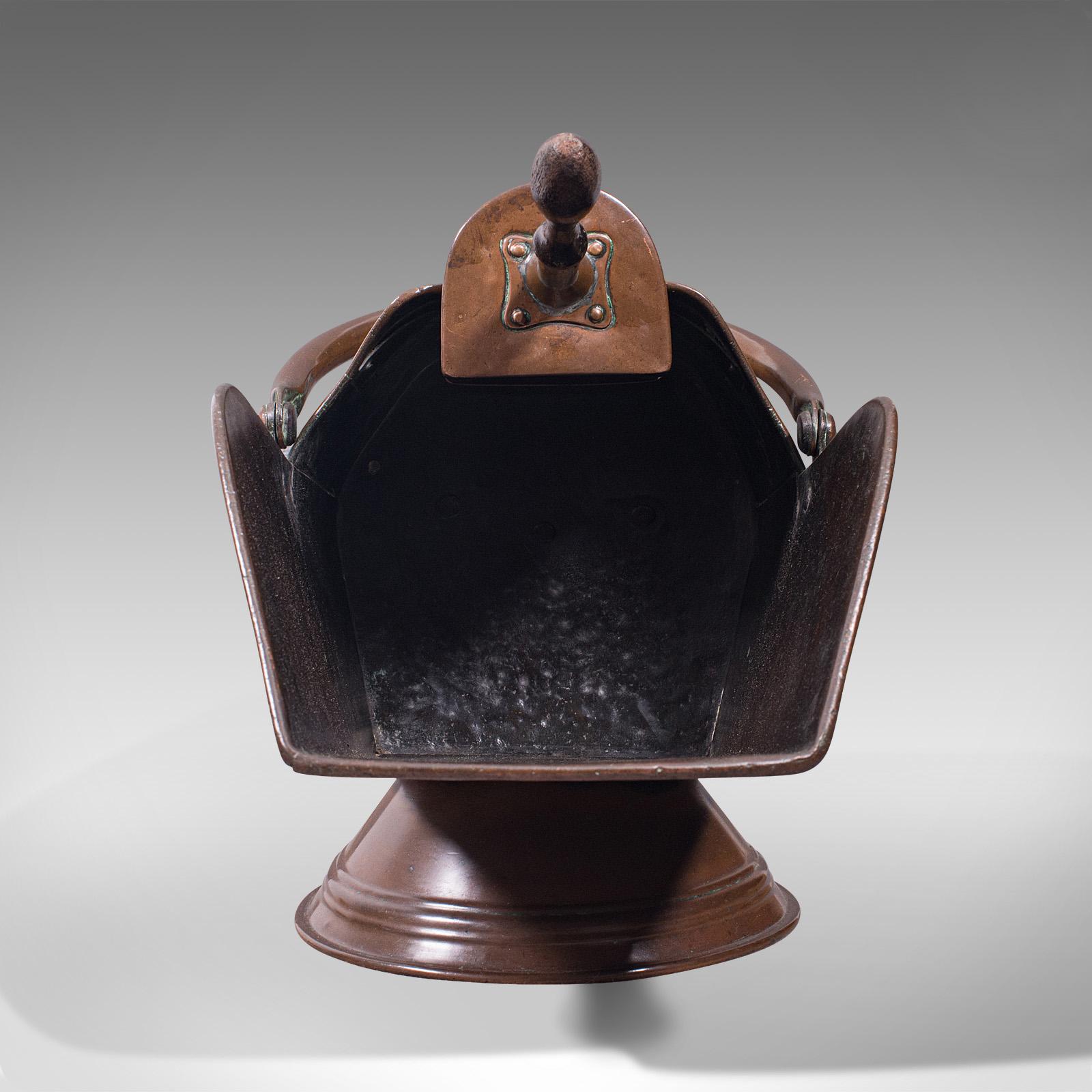 This is an antique coal scuttle. An English, copper fireside bucket and scoop, dating to the Victorian period, circa 1880.

Attractive antique scuttle and companion coal scoop
Displays a desirable aged patina throughout
Rich copper tones and