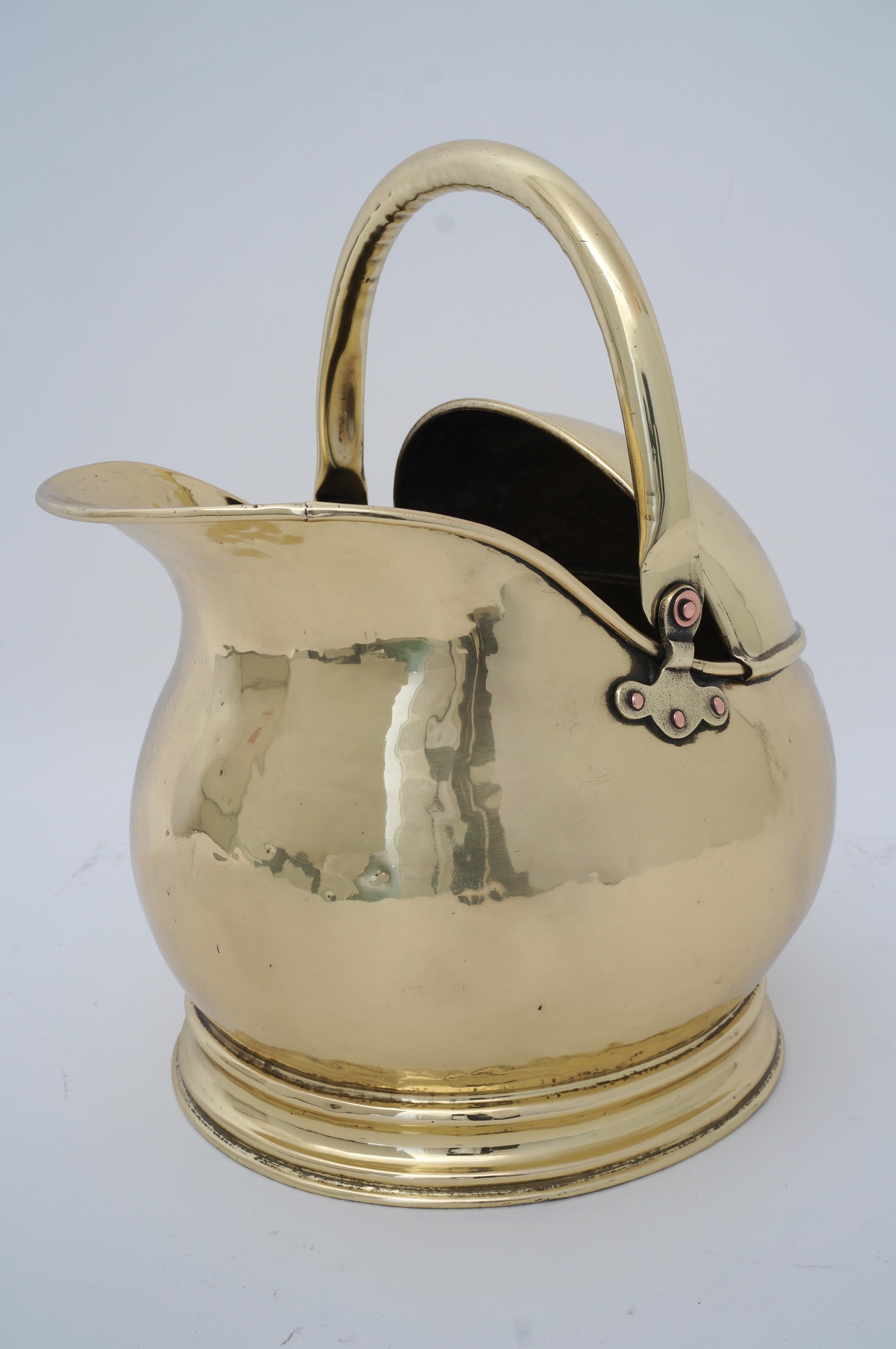 Antique Coal Scuttle polished brass for Firewood Holder from a Palm Beach estate. Has been professionally polished.

With handle down: measures 11 W x 14 D x 11 1/4 H
with handle raised, height rises to 14 1/2