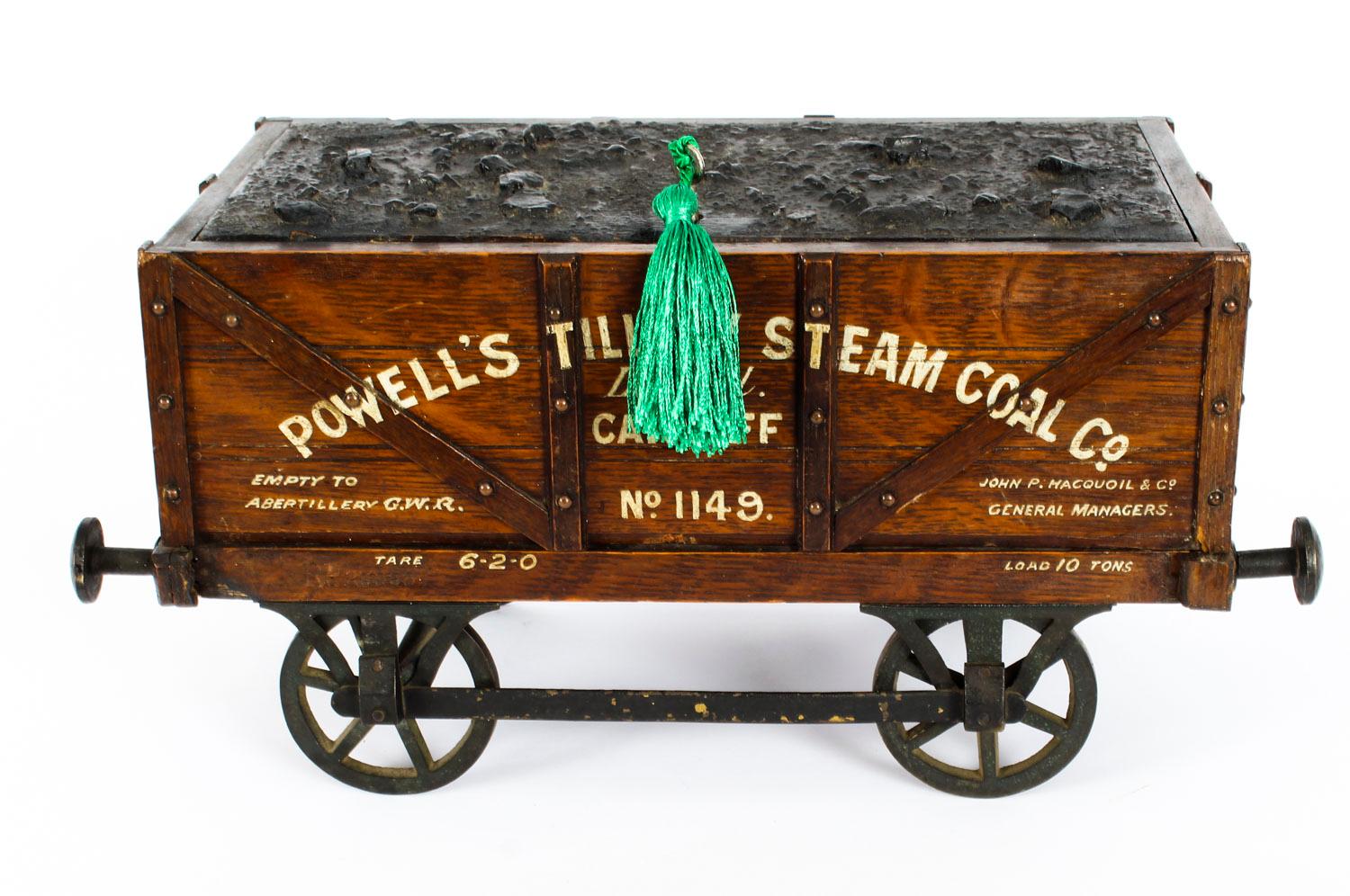 An unusual antique English oak novelty railway interest cigar humidor, circa 1880 in date.

The humidor is constructed in the form of a train's coal wagon. 

It features a simulated coal locking lift up top with a paneled body