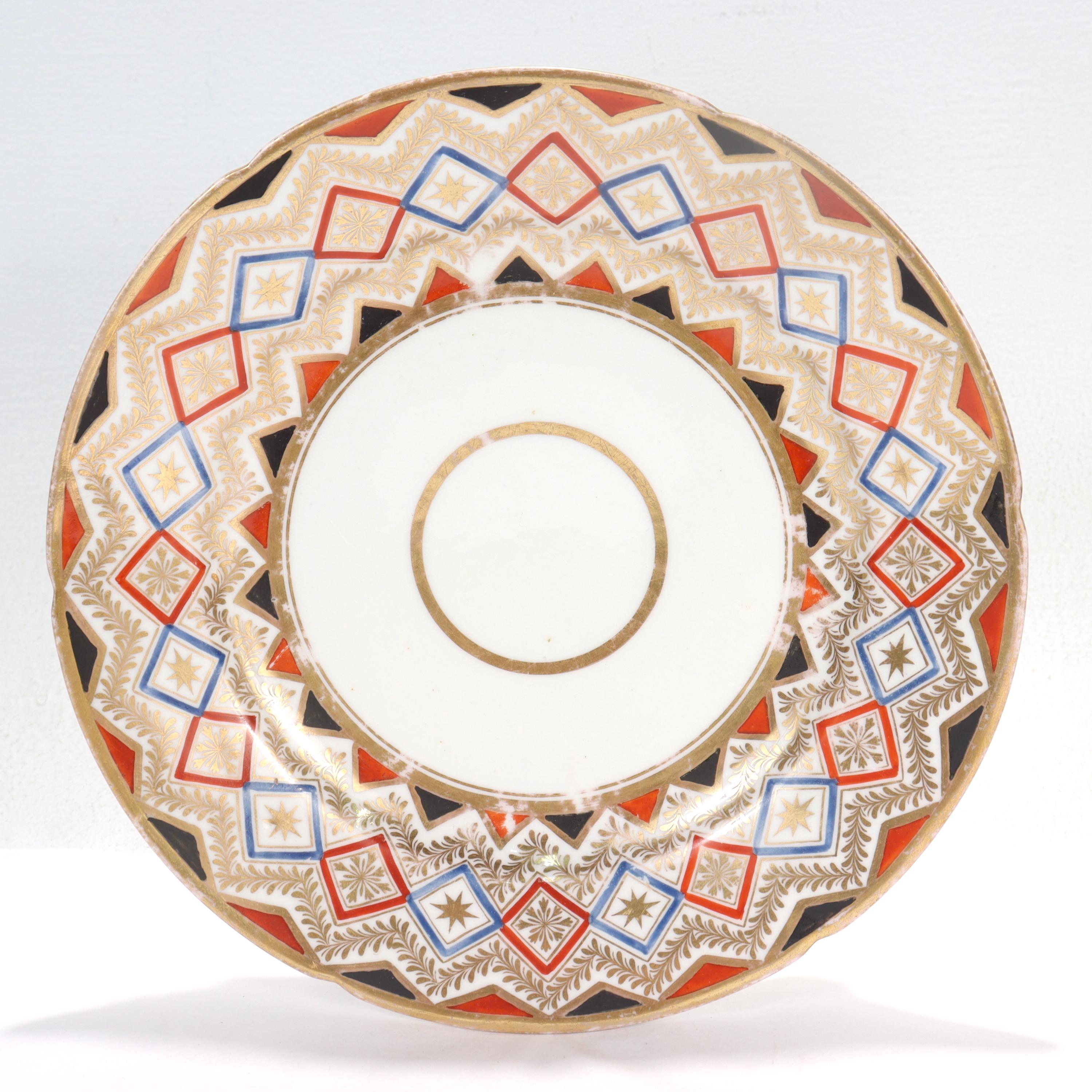 A fine English Neoclassical porcelain plate.

By Coalport.

Decorated throughout with alternating red and blue geometric patterns, gilt garlands, and gilt highlights in general.

Simply a great Coalport porcelain plate!

Date:
19th Century,