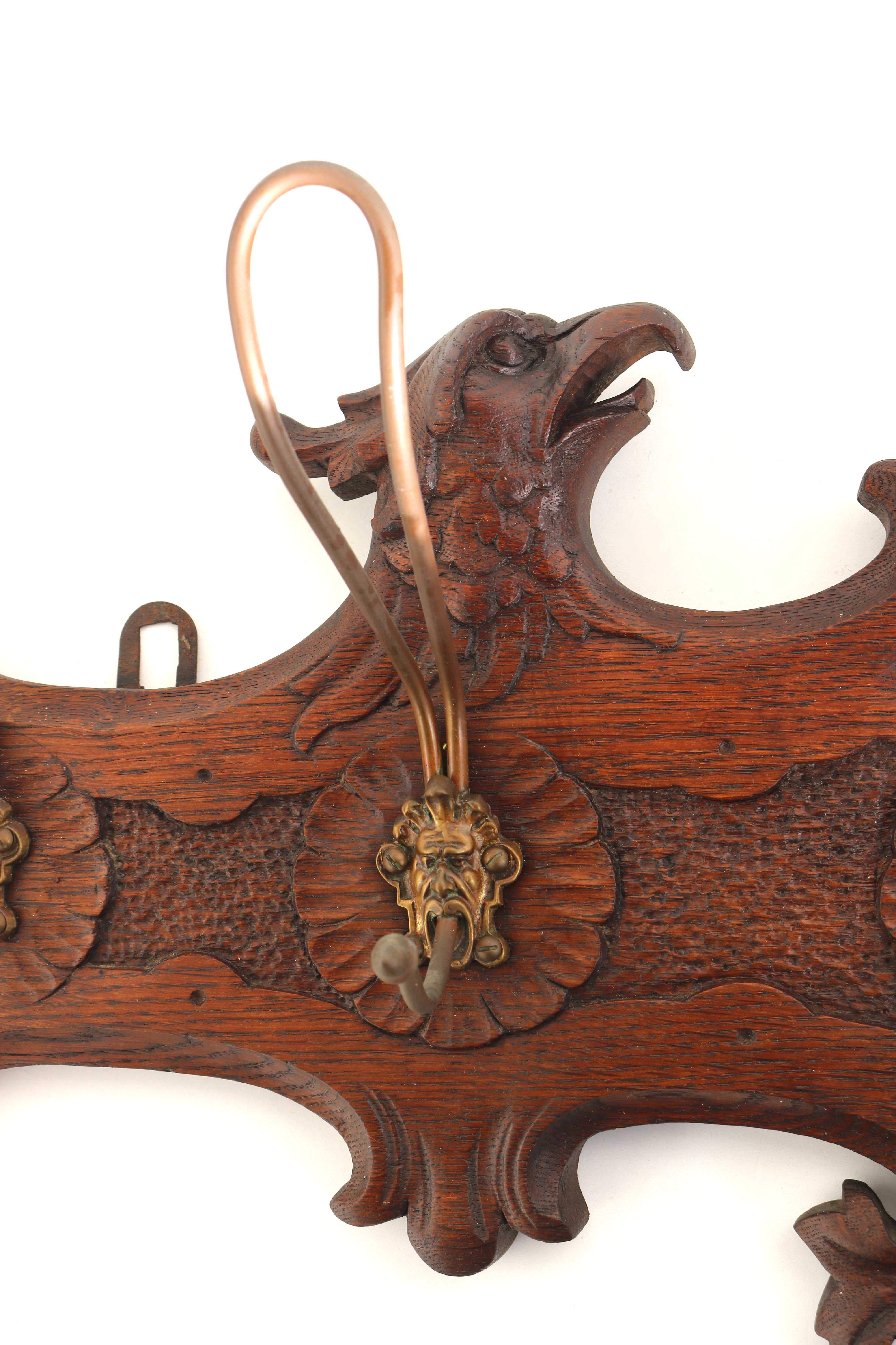 Renaissance Revival Antique Coat Rack Wood Carved Mask and Eagle, Mirror, Brass Hooks 19th Century  For Sale