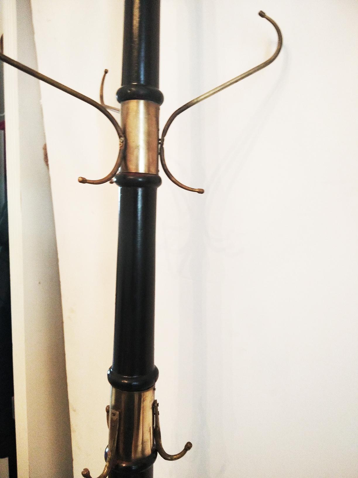 Tree type stand coat, very tall in ebonized wood and bronze or brass

It has several hangers in different heights to hang from the hat on top, coats, bags and canes

It is spectacular and very practical with great capacity
late 19th or early