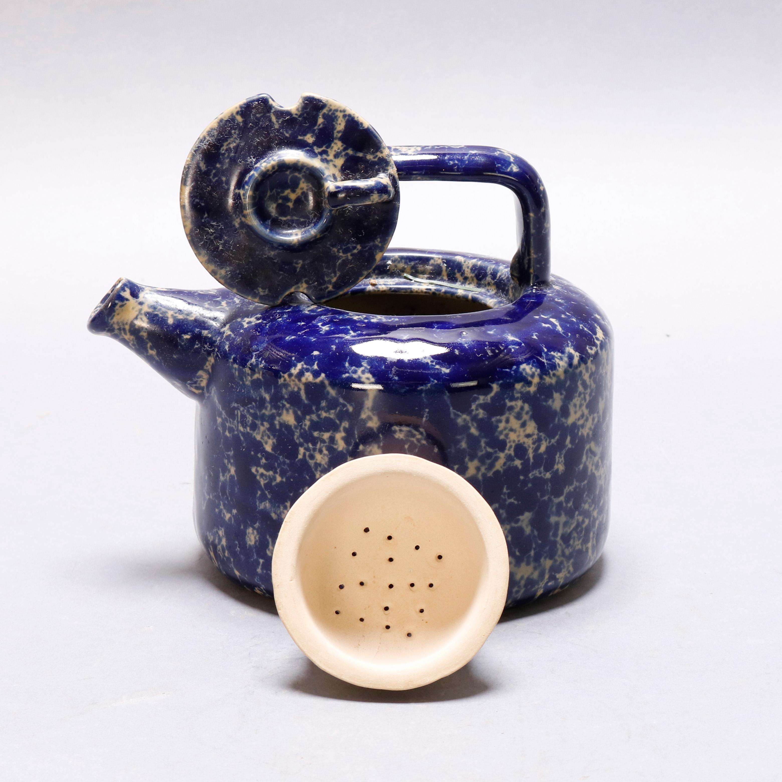 An antique ceramic teapot offers cobalt blue spongewear decoration and includes lid and strainer, 19th century

Measures - 6.5
