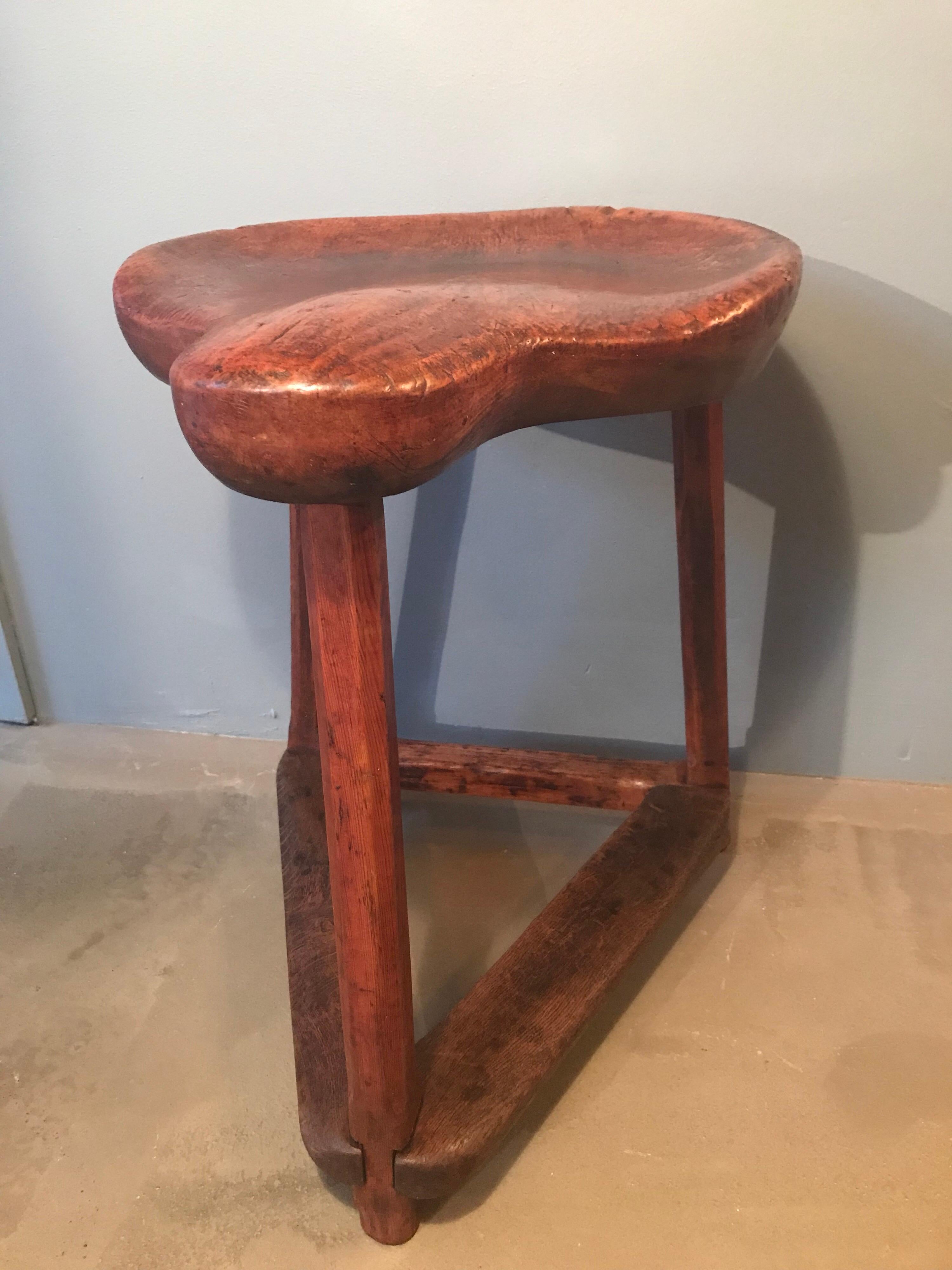 Hand-carved antique cobblers stool with the seat and legs made out of cherry wood and the foot rests made out of oak.
Great piece of vernacular furniture with lovely colour wear and patina to the wood.
Presumably from the 18th century.