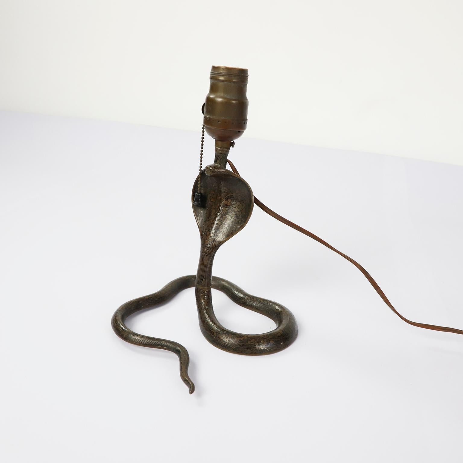 Circa 1940. We offer this rare Antique Cobra table lamp made in solid brass.