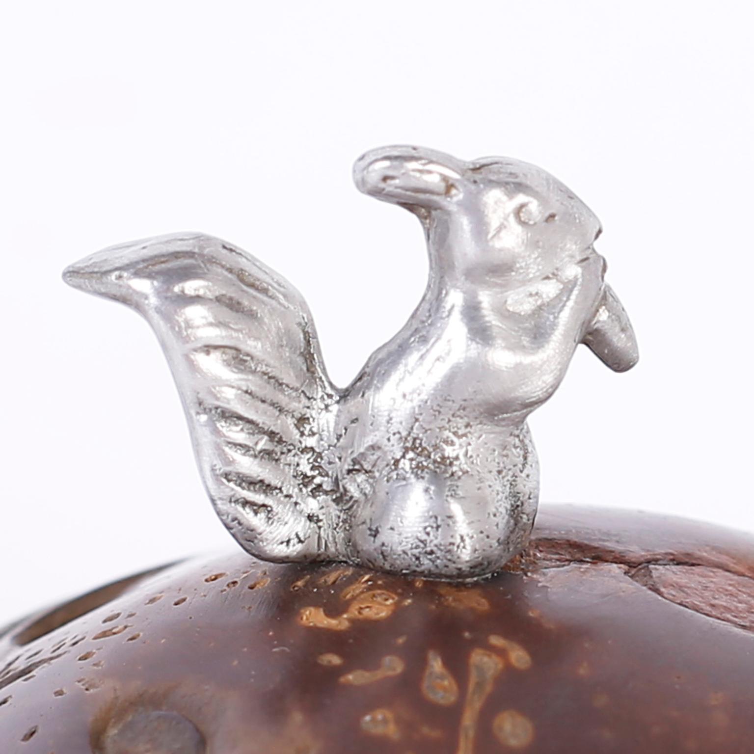 Anglo-Indian lidded container crafted with a polished coconut and silver metal with the unexpected squirrel handle.