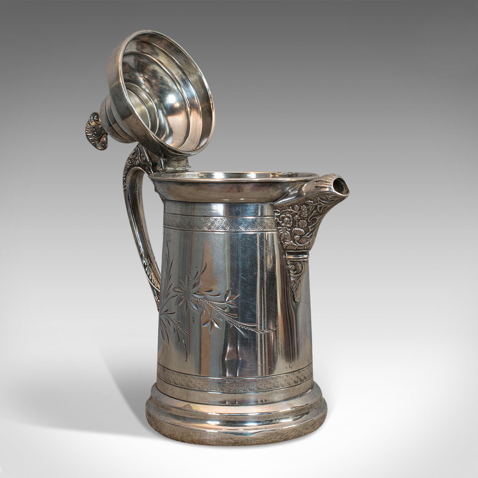 This is an antique coffee pot. An English, silver plated beverage jug, dating to the late 19th century, circa 1900.

Attractive coffee jug with fine engraved detail
Displays a desirable aged patina
Plate silver in very good order
Bright, polish