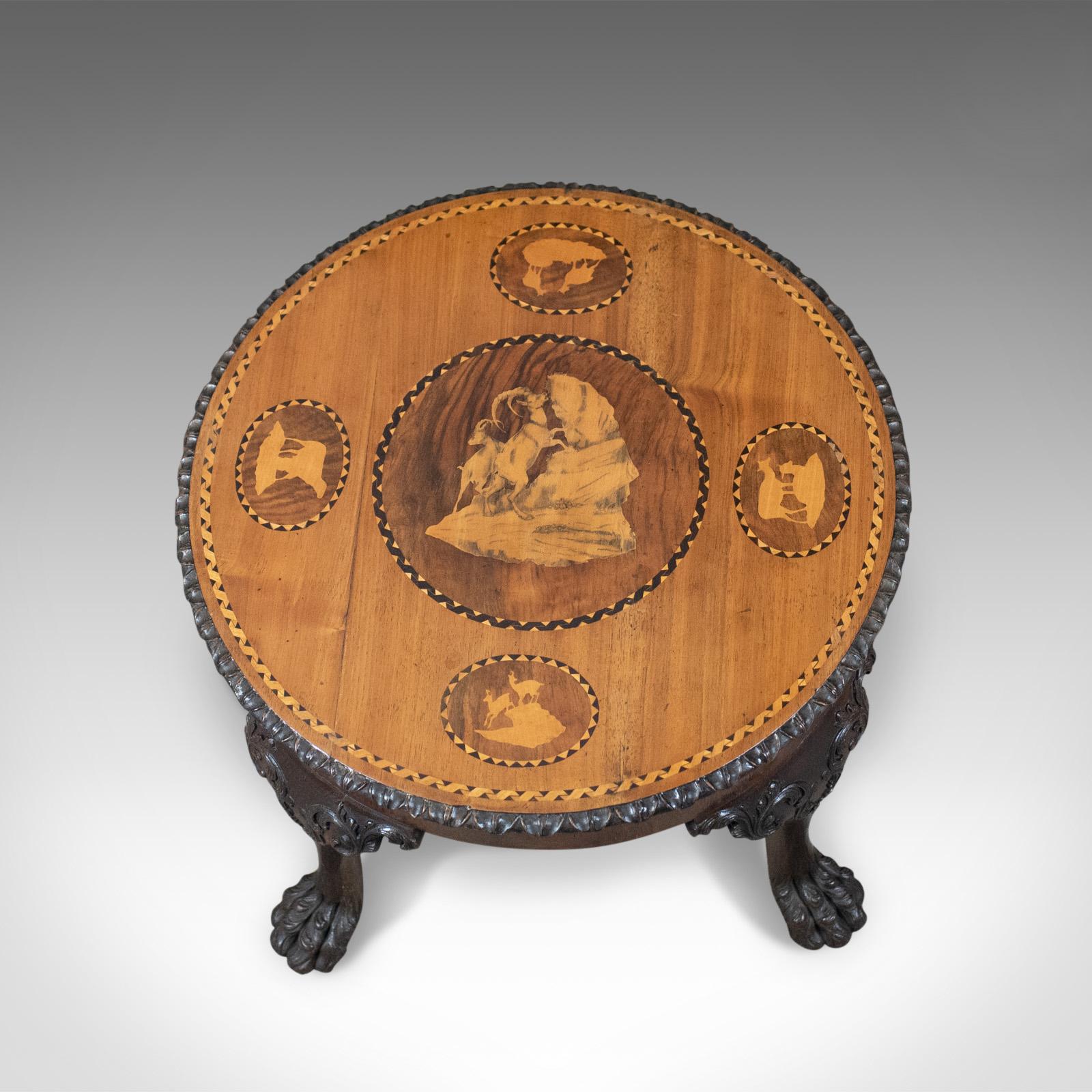This is an antique coffee table, an English, Victorian side table in oak with an inlaid marquetry top dating to the mid 19th century, circa 1870.

Unusual low form offering a solid and stabile surface
English oak with a deep rich colour and