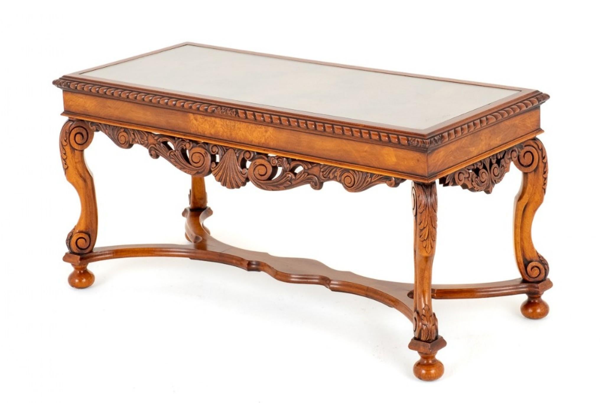 Superior Carolean Style Walnut Coffee Table.
Raised upon Typical Carolean Style Shaped and Carved Legs and a Shaped Stretcher.
Circa 1930
The Table Features a Shaped and Carved Frieze.
The Top of the Table Having Book Matched Burr walnut Veneers and