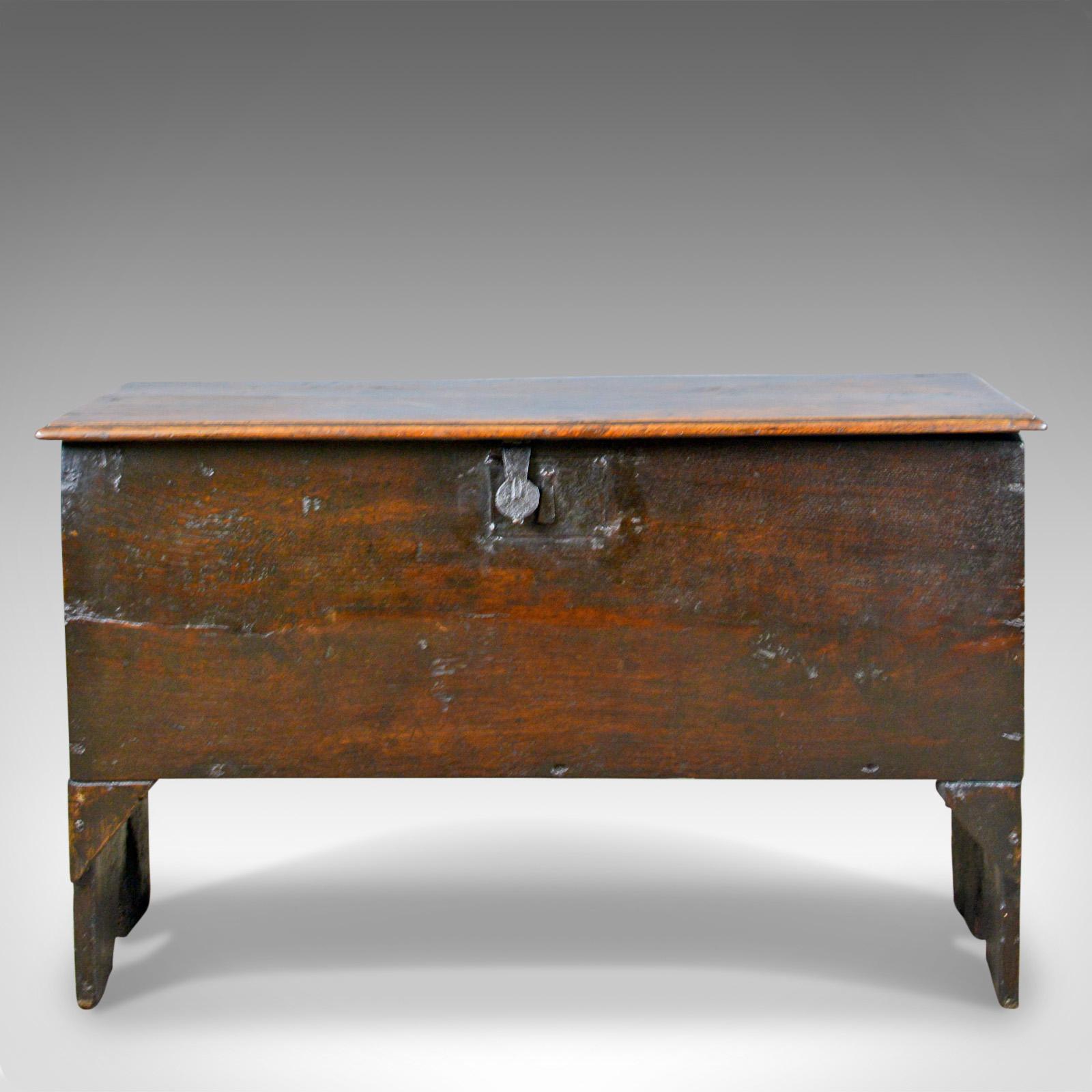 This is an antique coffer, a 6 plank sword chest in English oak dating to the 17th century c.1660

Classic six board construction
English oak with desirable aged patina
Raised on extended stiles to the ends

The top displays well with molded