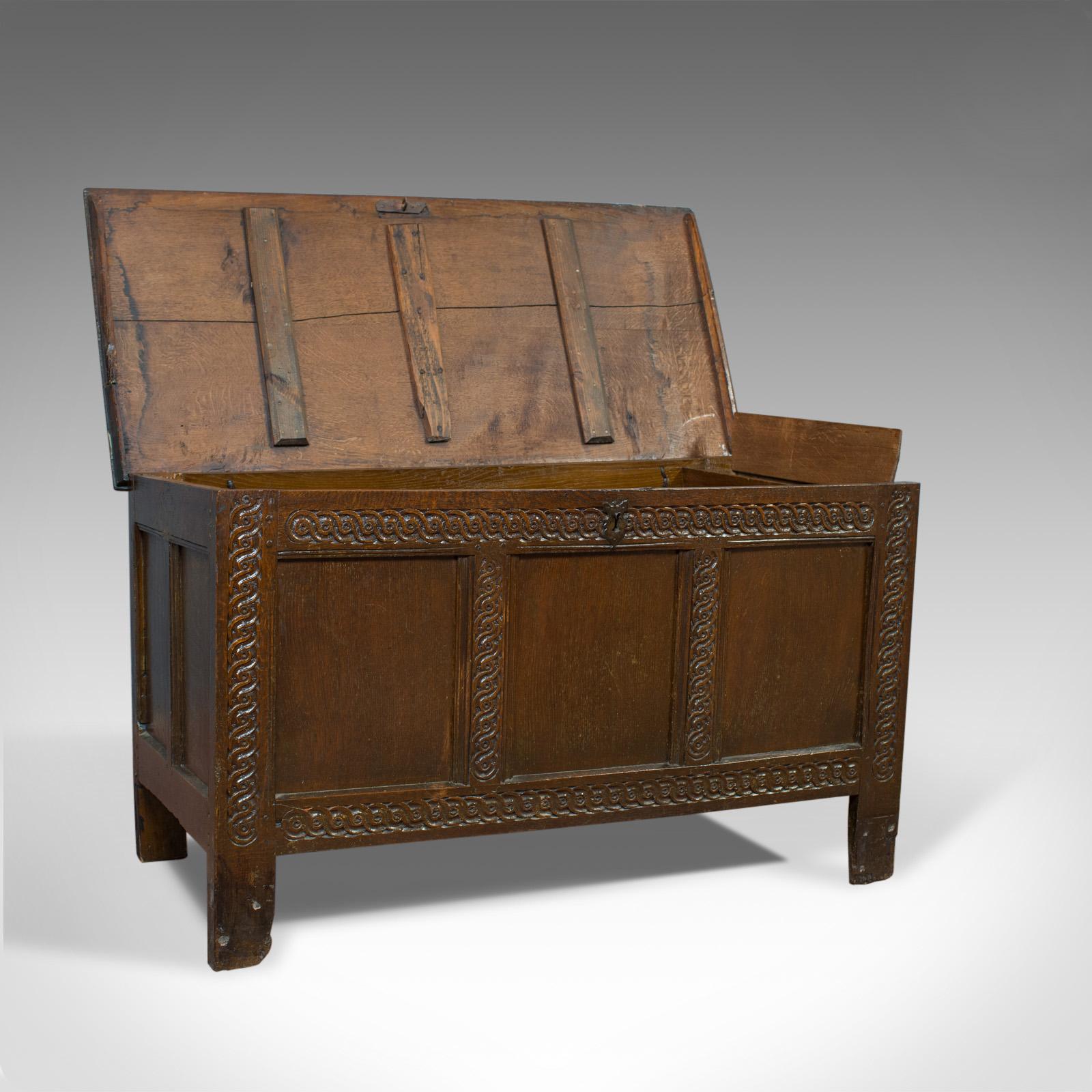 This is an antique coffer, a late 17th century, English oak, joined chest. A Charles II trunk dating to circa 1685.

Substantial oak chest displaying rich, dark colour
Pegged joint construction with grain interest throughout
Triple panel chest