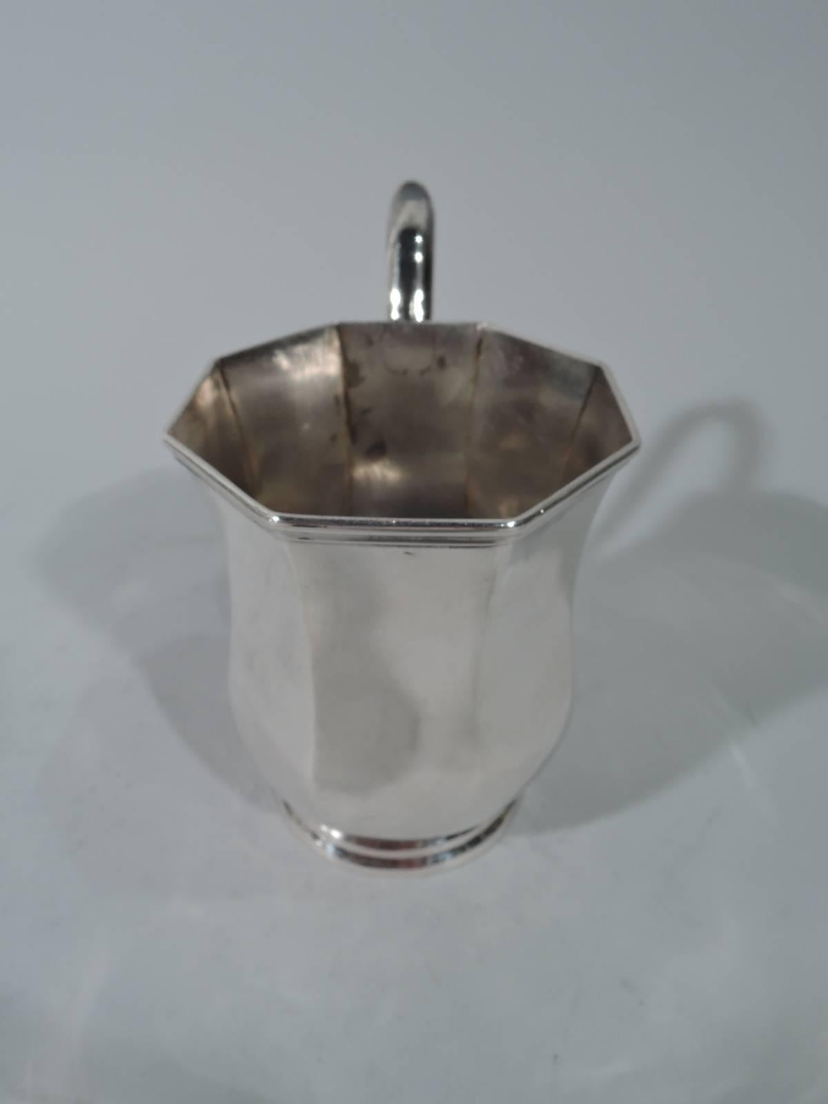 Coin silver baby cup. Made by Nicholas J Bogert in New York. Faceted baluster with capped high-looping handle and stepped foot. Lots of room for engraving. A nice piece by a historic regional maker who was active circa 1800-1825. Weight: 4.5 troy