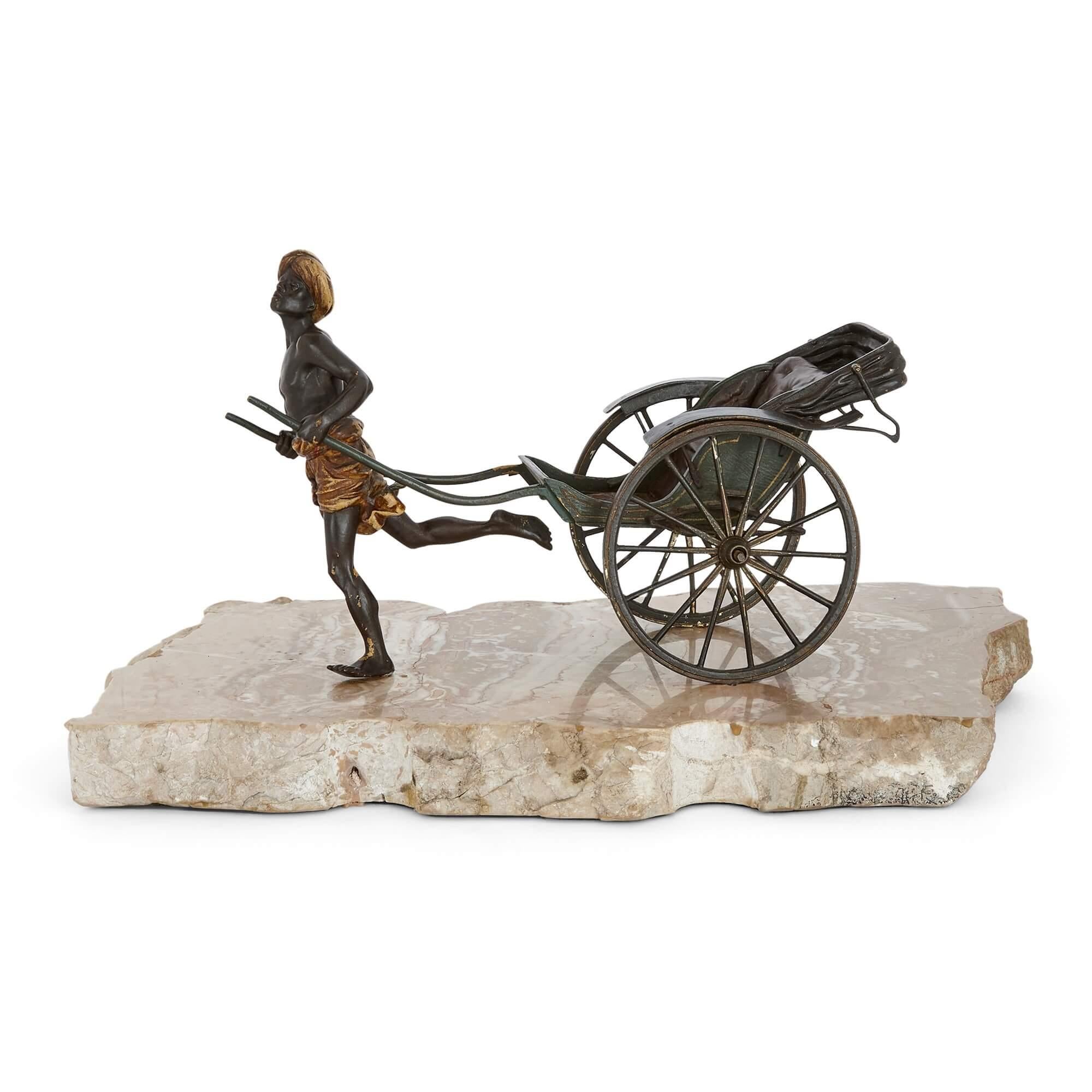 Antique cold-painted bronze of a pulled rickshaw by Bergman 
Austrian, c. 1910
Height 19cm, width 37cm, depth 20cm

This unusual cold-painted bronze depicts a running Arab man, who pulls an old-fashioned rickshaw cart behind him. The figure is